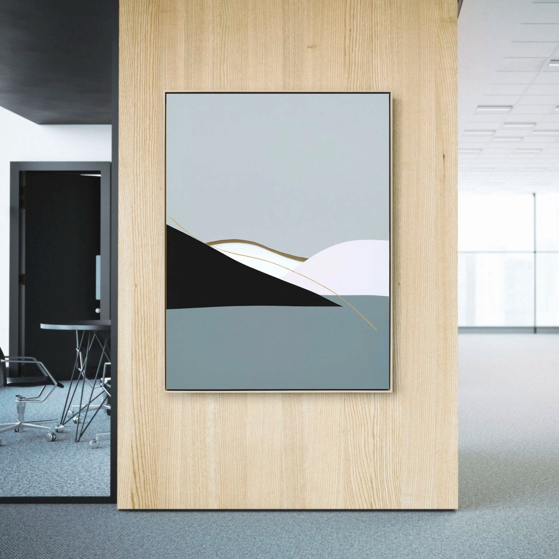 Amy Stewart abstract prints,  Modern abstract artwork with shapes in black, white, gray, and gold on a wooden wall in an office setting.