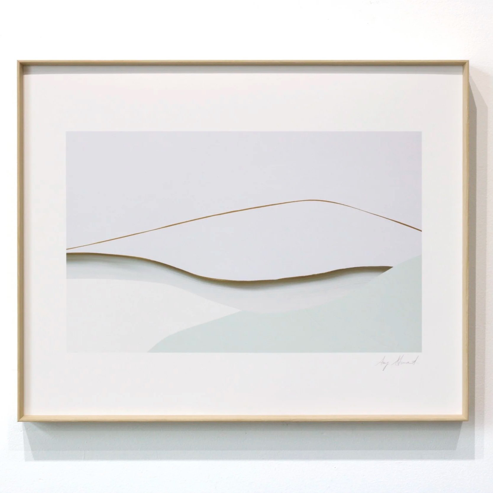 Minimalist Amy Stewart landscape artwork with layered shapes in soft white and pale blue, framed in light wood.