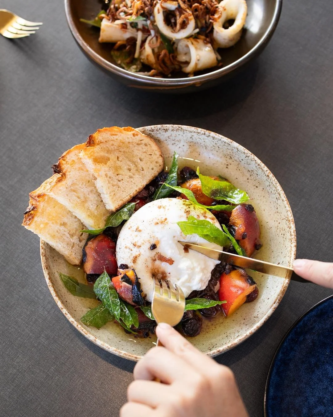 Cut into this. 🤍

Creamy burrata nestled over sweet caramelised onion and juicy stone fruit, finished with fragrant curry leaf and served with golden crostini.

Sweet. Savoury. Silky.
The kind of dish you fight over the last scoop for. ✨