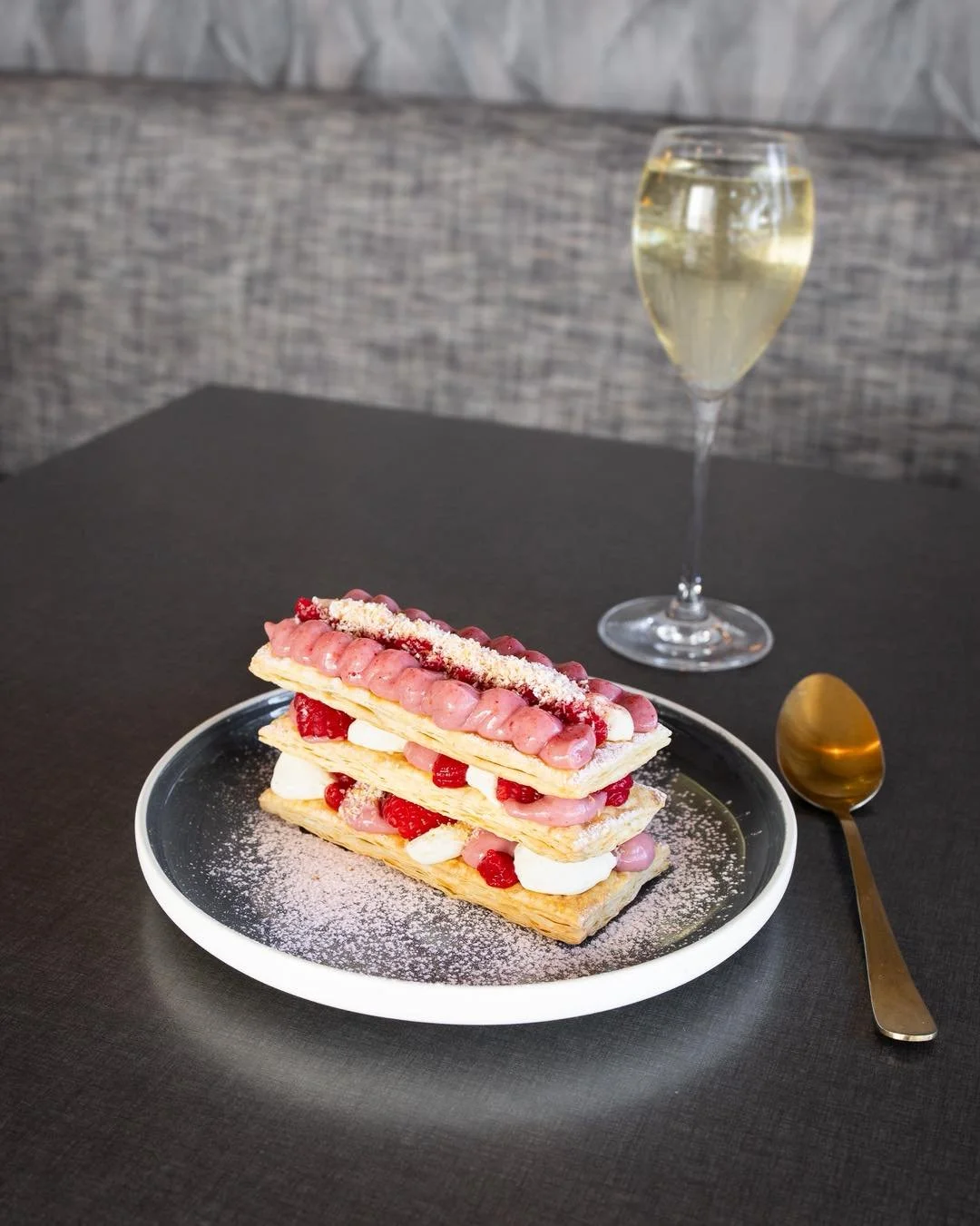Remember that mille-feuille we mentioned in our last dessert post?

Well&hellip; isn&rsquo;t she a beauty.

Layers of delicate pastry with cr&egrave;me p&acirc;tissi&egrave;re, raspberry and coconut &mdash; pretty close to the perfect way to finish y