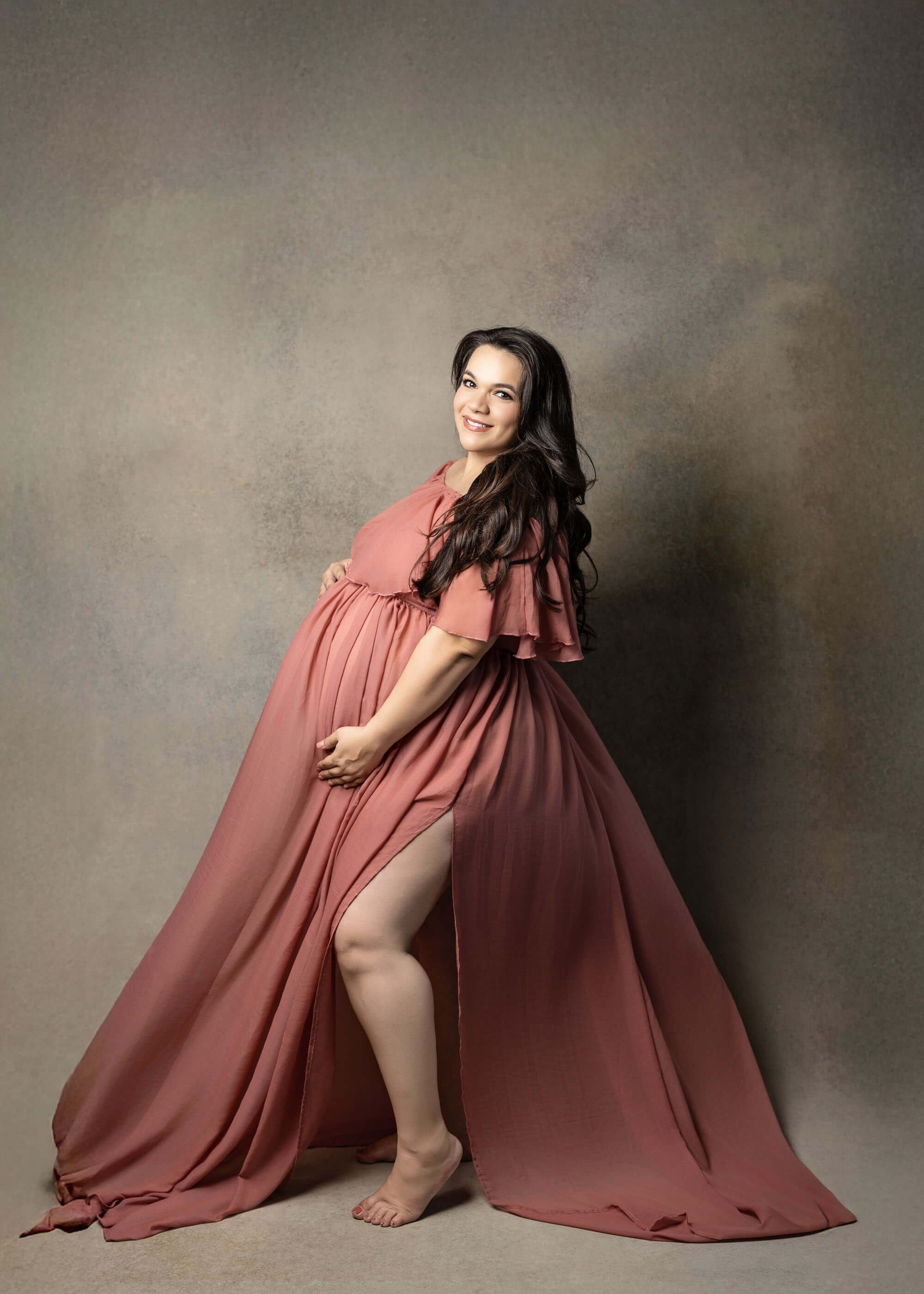 Pregnant woman on pink dress on hand canvas painted at Fort Worth studio