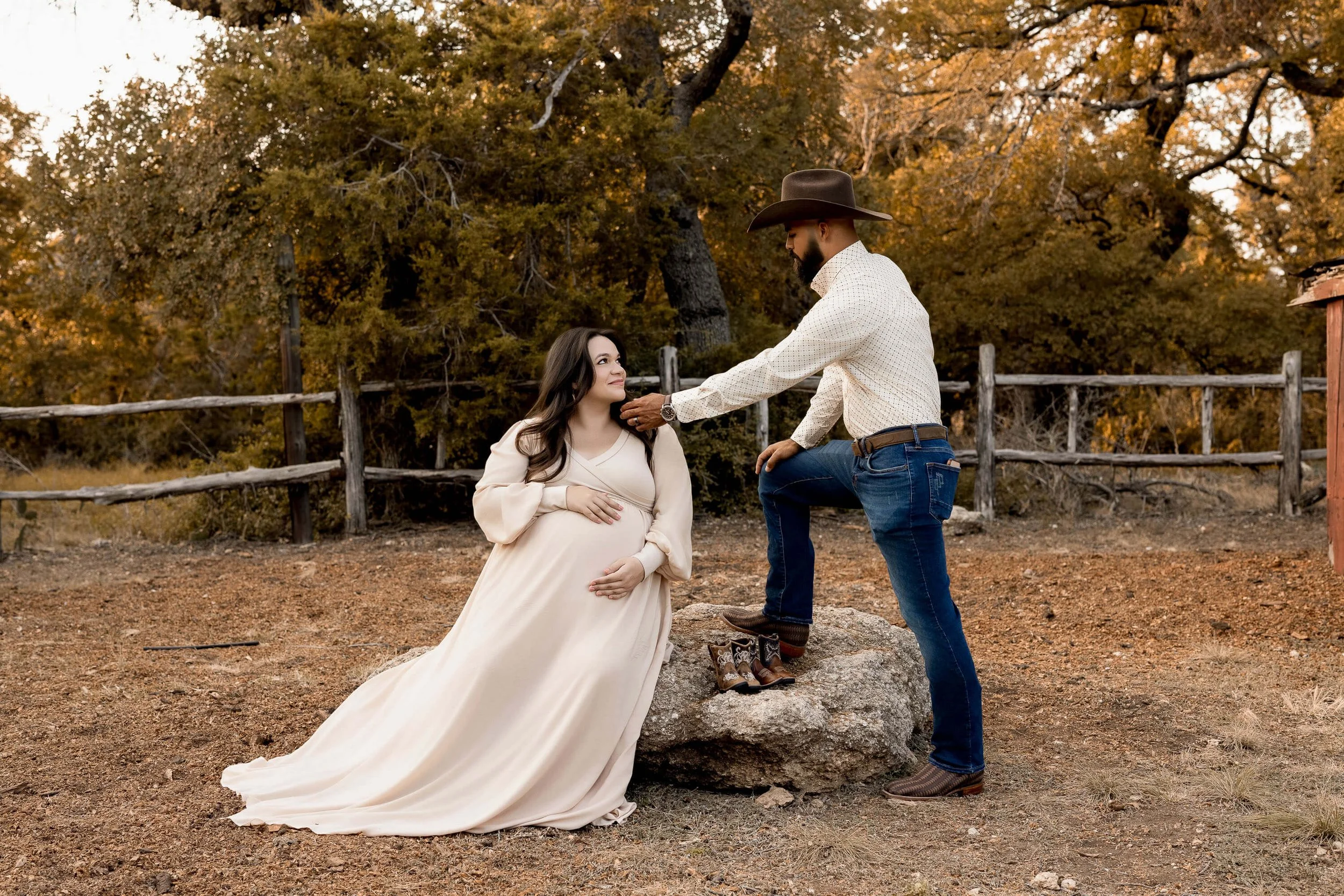 pregnant lady and husband touching her face at Eagle Mountain Park