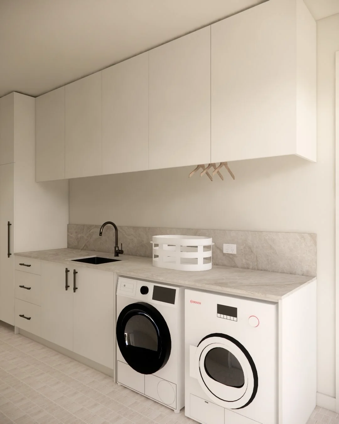 Mount Eliza house, a new split-level four-bedroom family home with Hoad Building Co.
The laundry and pantry are finished in the same neutral tones as the kitchen. The laundry features open skirting in a tall cupboard for a robo-vac, with a hanging ra