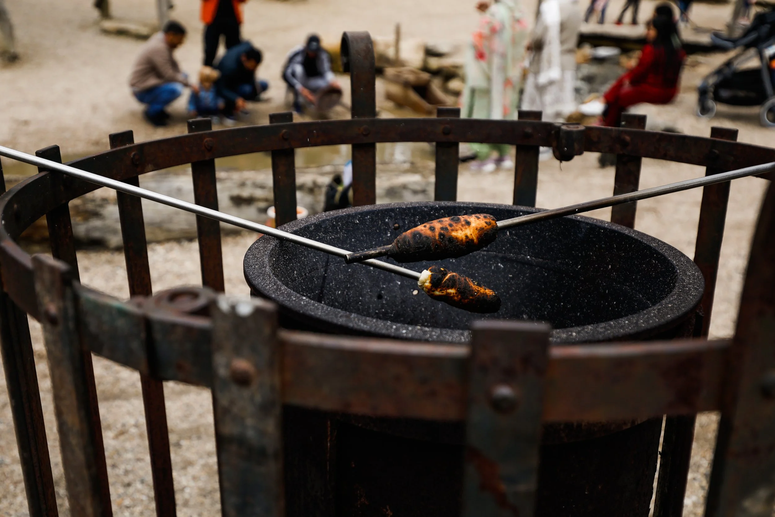 Damper cooking on a stick over a fire pit
