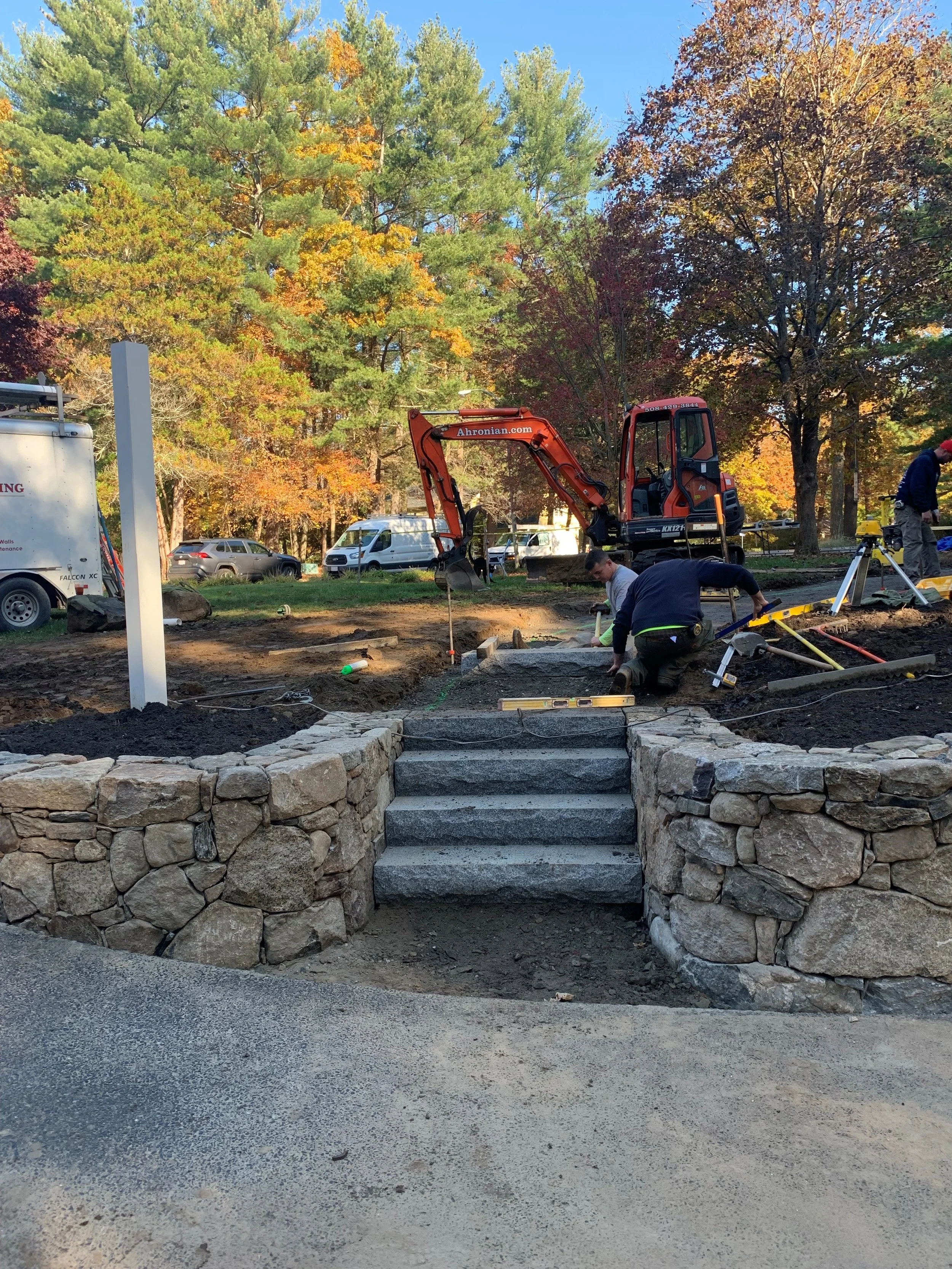 Retaining wall installation, Soil erosion, Drainage solutions, Landscape stability, Outdoor living spaces, Stone retaining walls, Retaining wall contractor, Property drainage