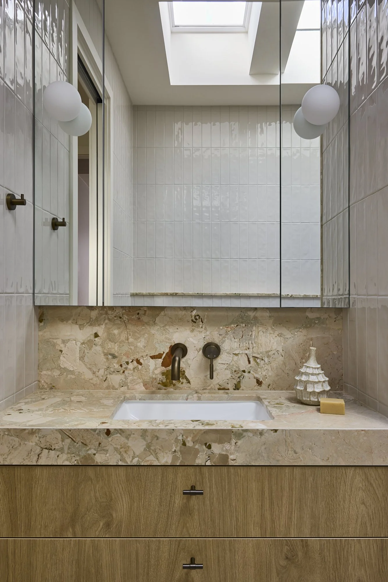 Natural stone vanity detail in a premium Sydney terrace renovation.