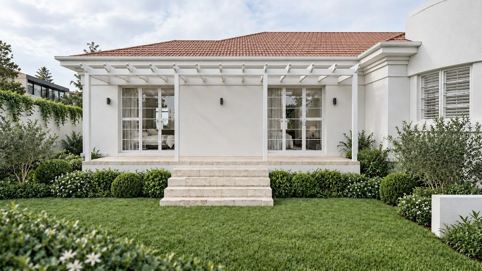Single-storey rear extension at P&O House, with white walls, a pergola and French doors opening towards the garden.