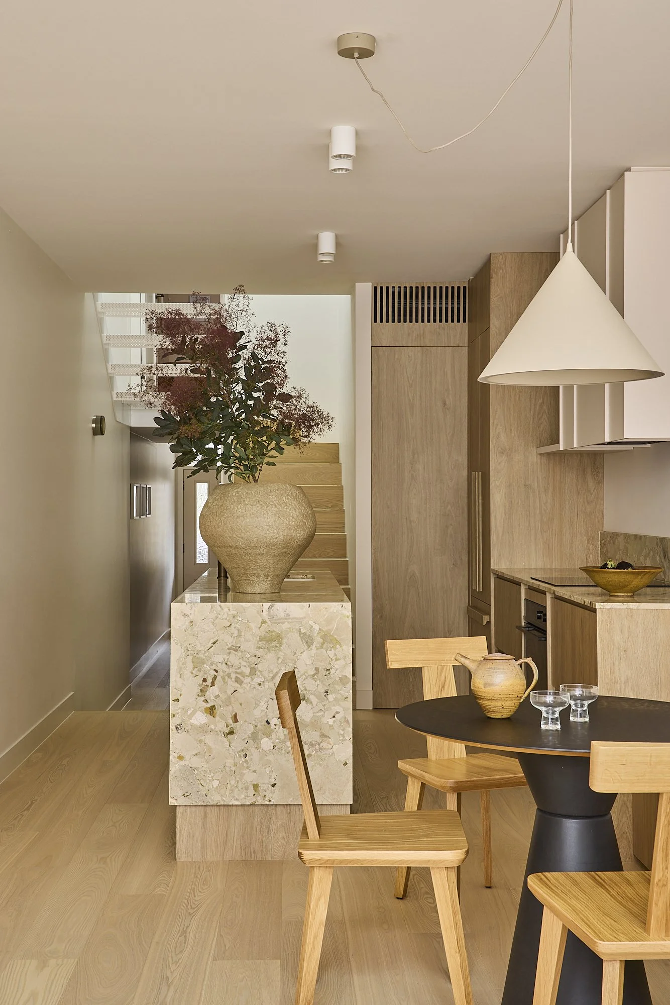 Stone island and timber cabinetry in a premium heritage terrace renovation in Balmain, Sydney.