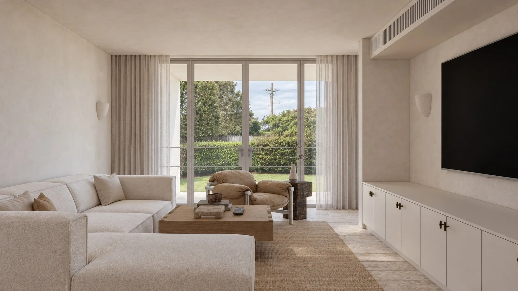 Media room at P&O House with built-in cabinetry, relaxed seating and glazed doors connecting to the garden.