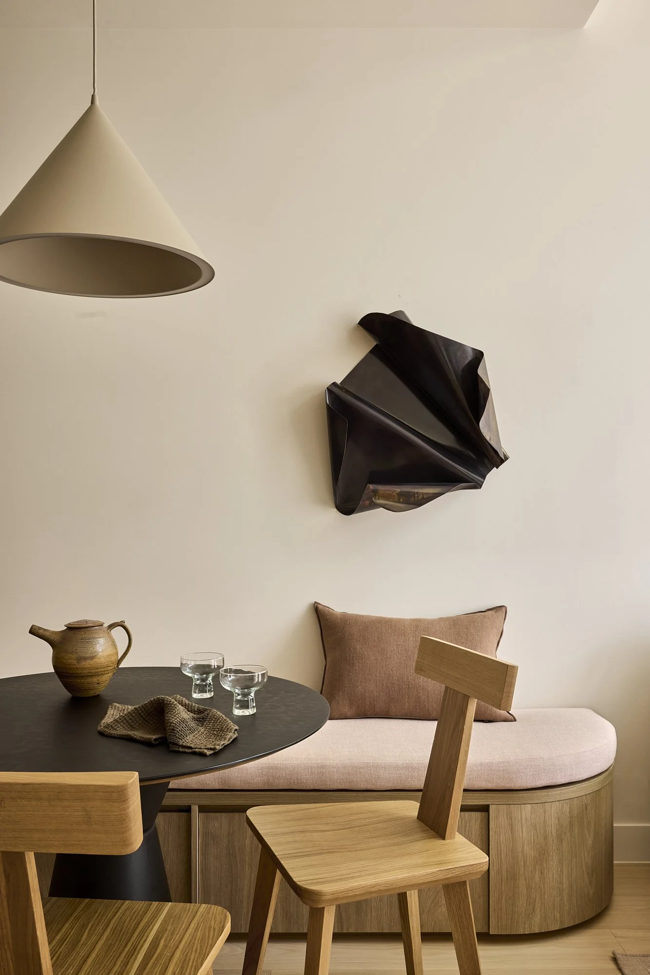 Dining banquette and sculptural pendant in Balmain Terrace renovation by Passer Architects