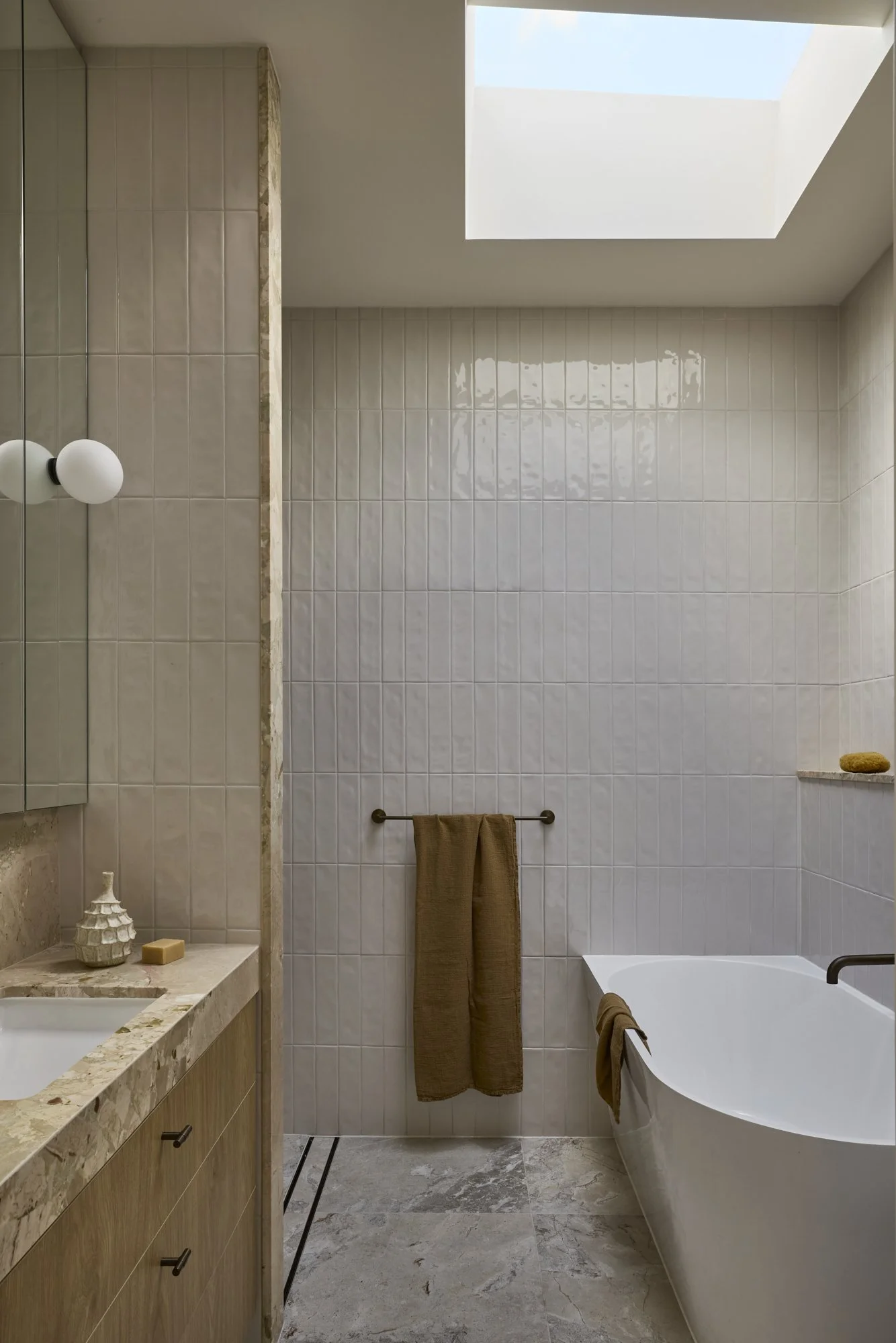 Freestanding bath beneath skylight in a heritage terrace renovation in Balmain, Sydney.