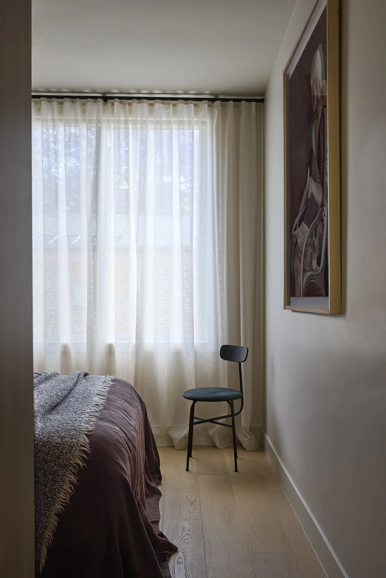 Layered textures in the main bedroom of a premium Balmain terrace renovation.