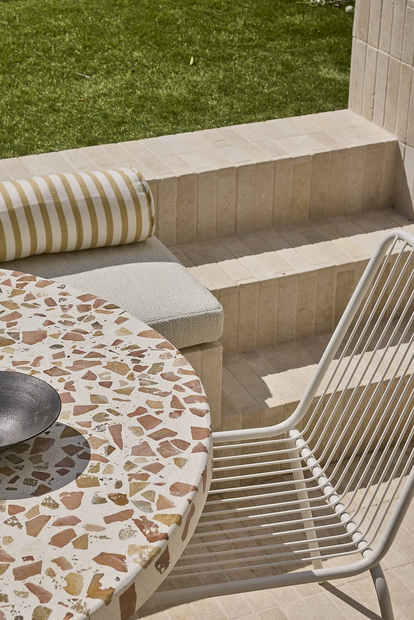 Layered outdoor seating and tiled steps in a contemporary Balmain heritage terrace renovation by Passer Architects.