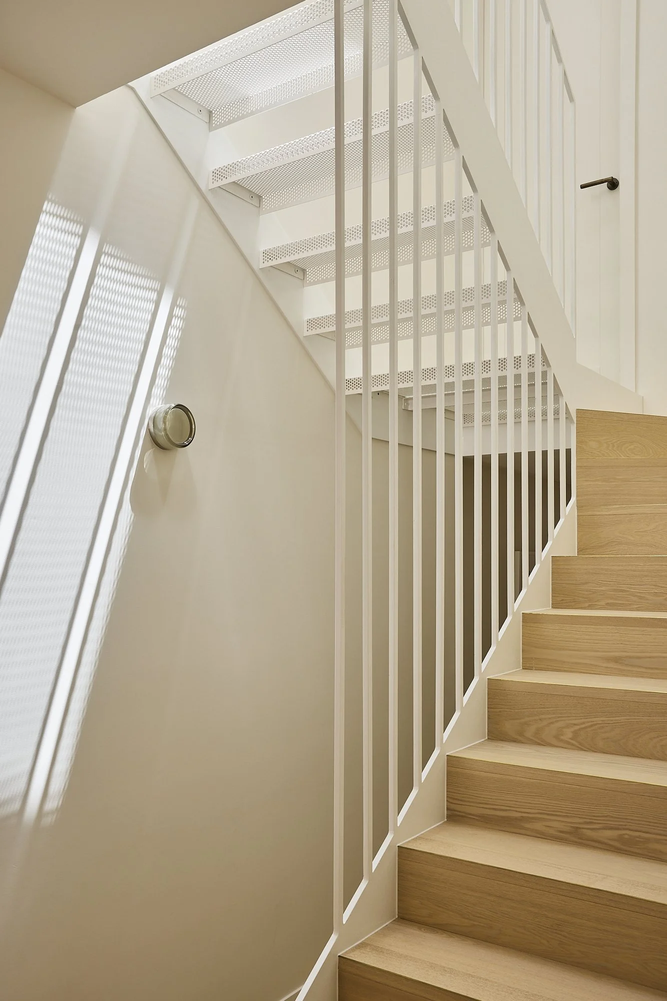 Timber staircase with white steel balustrade in a Balmain heritage terrace renovation.
