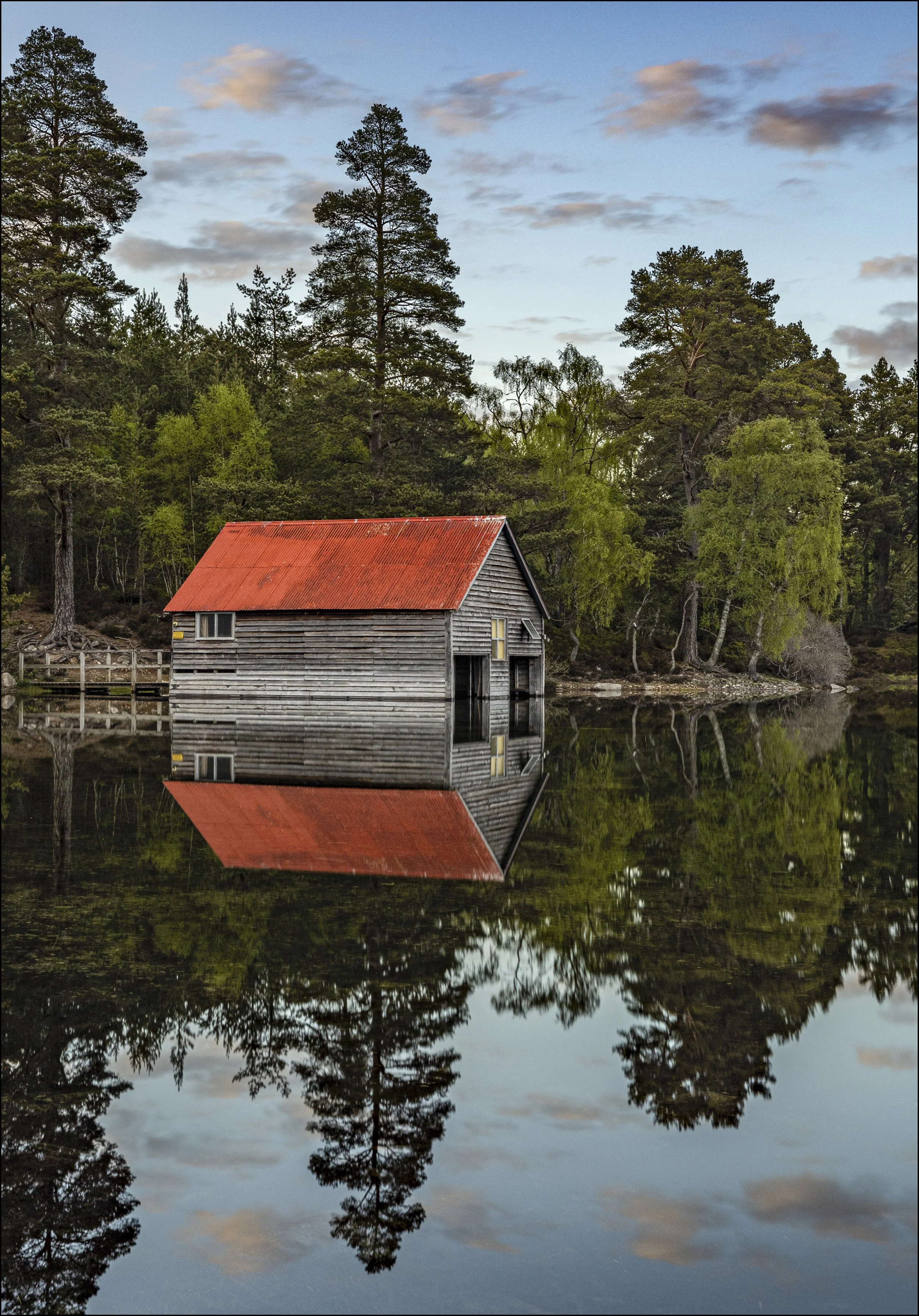 Loch Vaa boathouse reflection