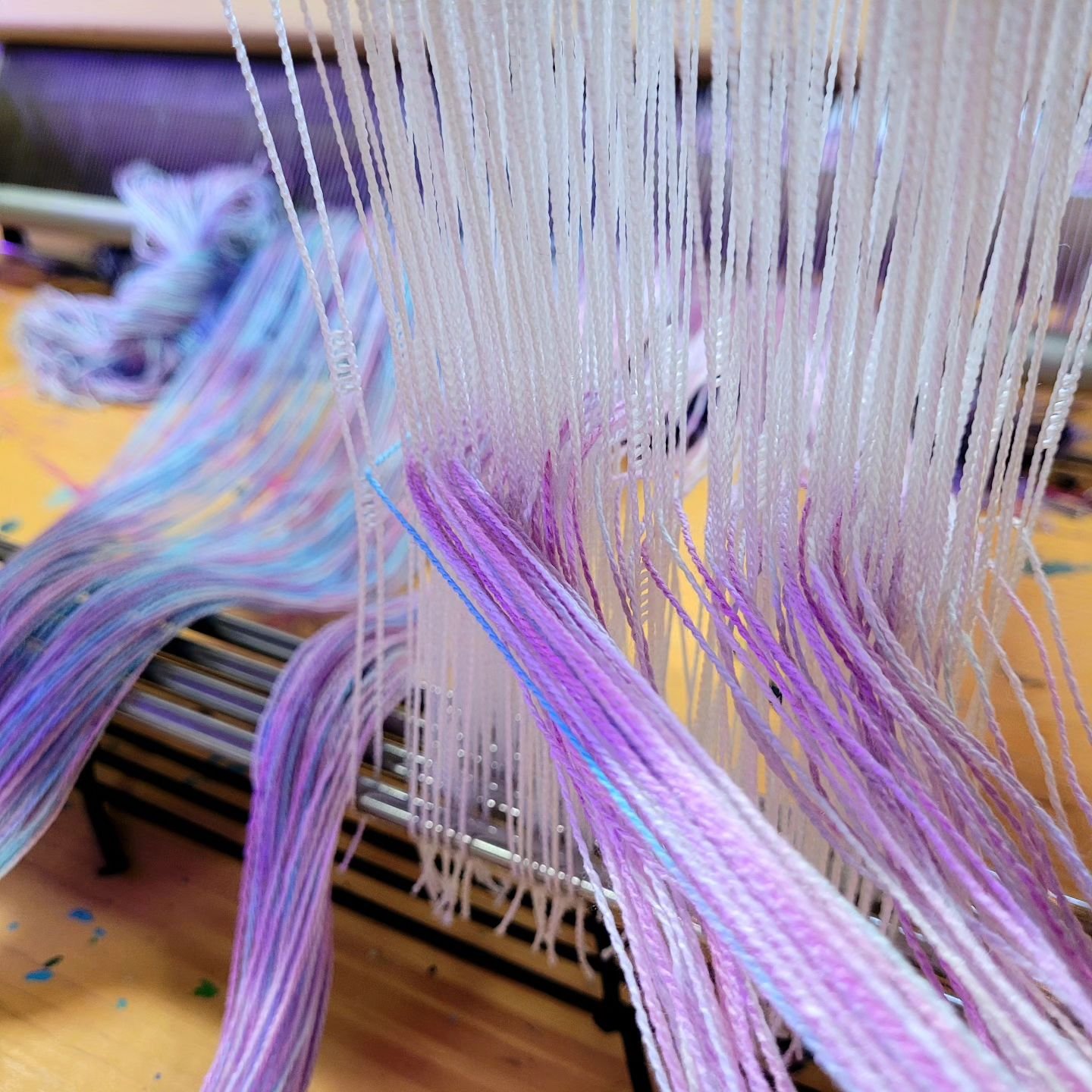 Threading this new hand dyed Tencel scarf warp on my table loom, just in time to weave it LIVE at Oak Street Art Fair next Saturday, April 27, in Murphysboro. Join me and lots of other artists with @oakstreetart1 and see all the talent Southern Illin