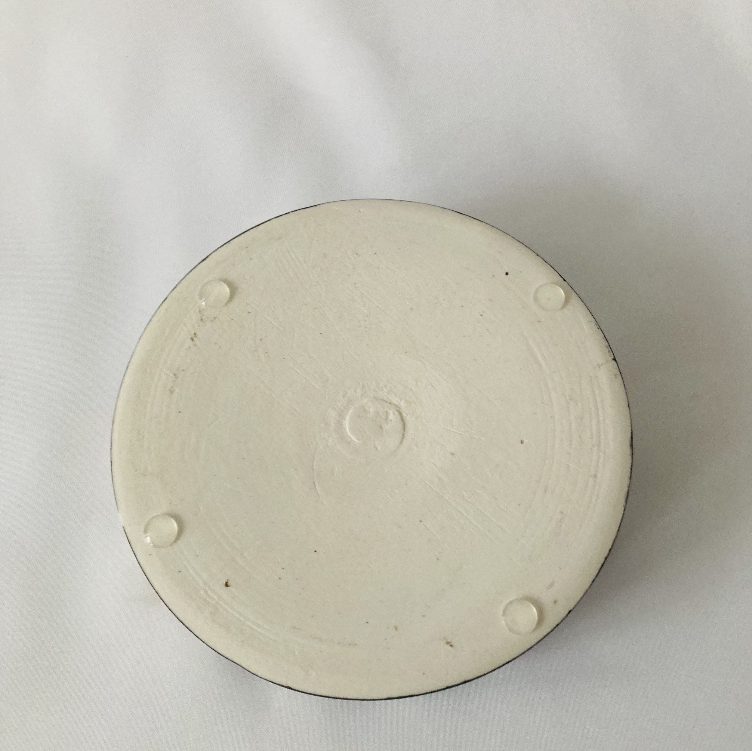 dish in black and white with orange inside viewed from base .jpg