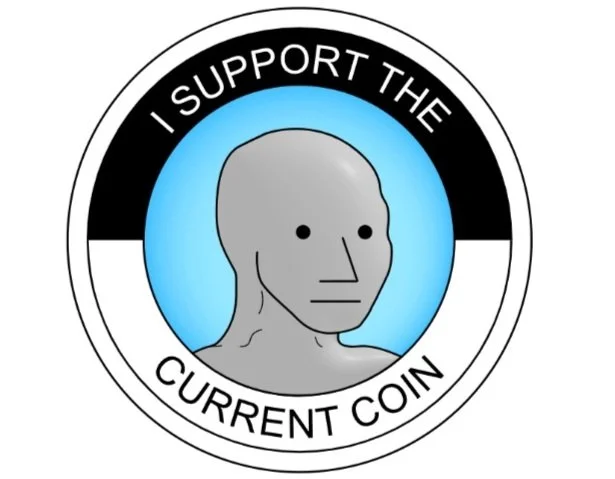 A coin with a gray, humanoid face, and the text 'I SUPPORT THE CURRENT COIN' around the top and bottom edges.