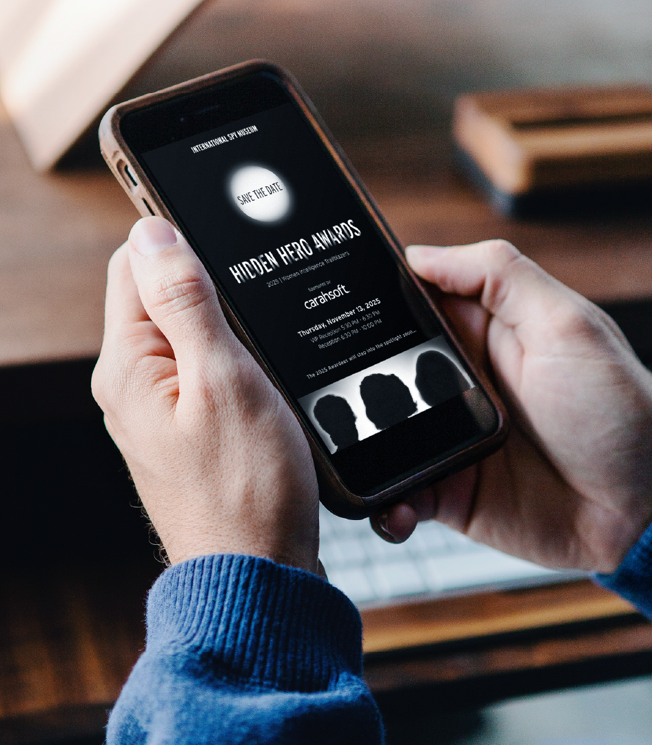 A man looks at the Hidden Hero Awards save-the-date email on his phone
