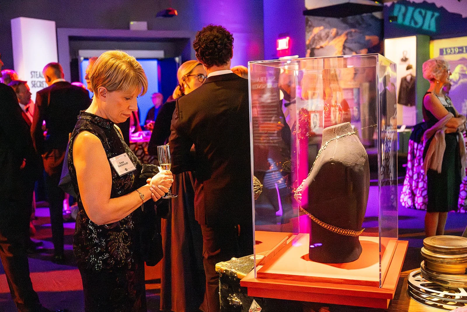 A woman admires an artifact on display at the International Spy Museum during the Hidden Hero Awards event.