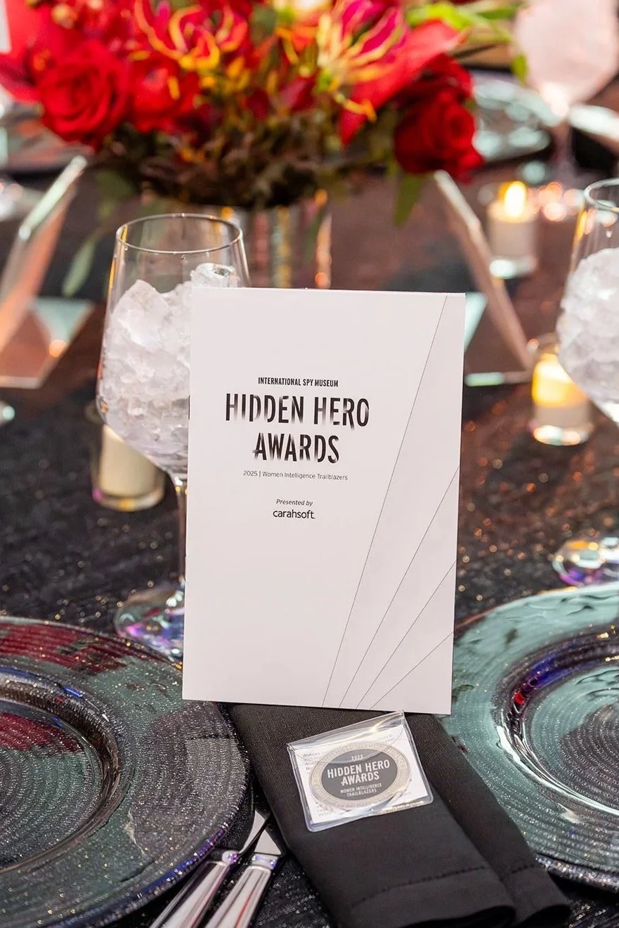 The official printed event program booklet waiting for guests on the dinner tables.