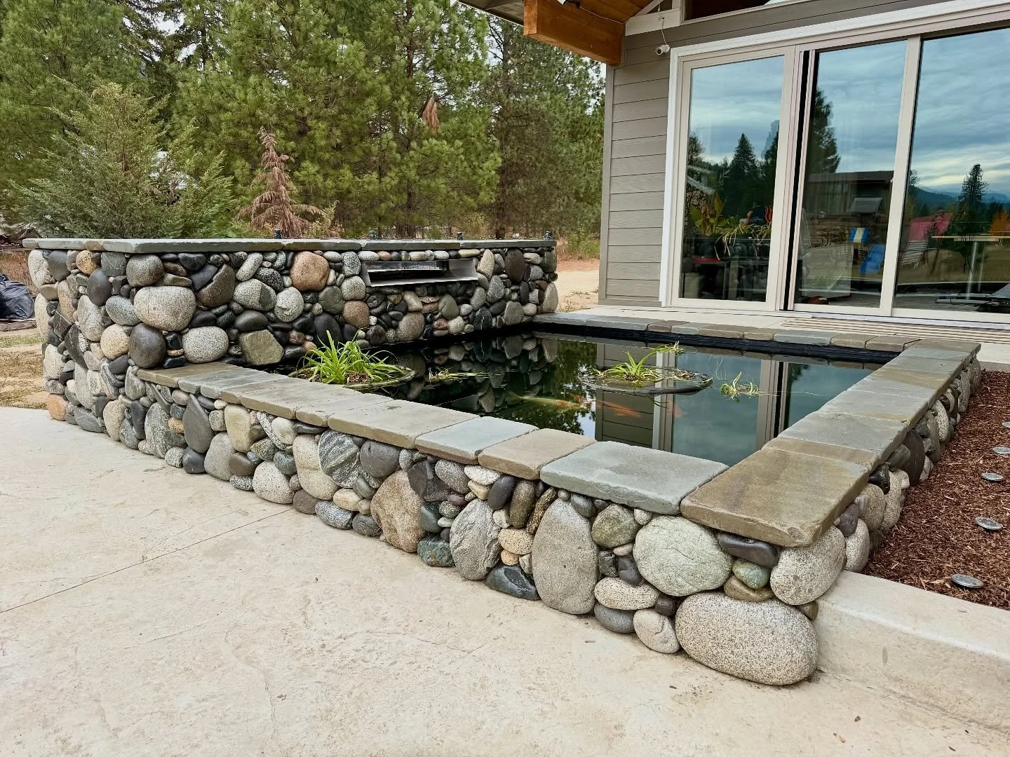 Finishing up this section of the project with sealer on the stone around the koi pond #millerstoneworks #stone #stoneart #stonework #stonemasonry #stonemason #naturalstone #drystackstone #design #stonedesign #construction #contractor #masonrycontract