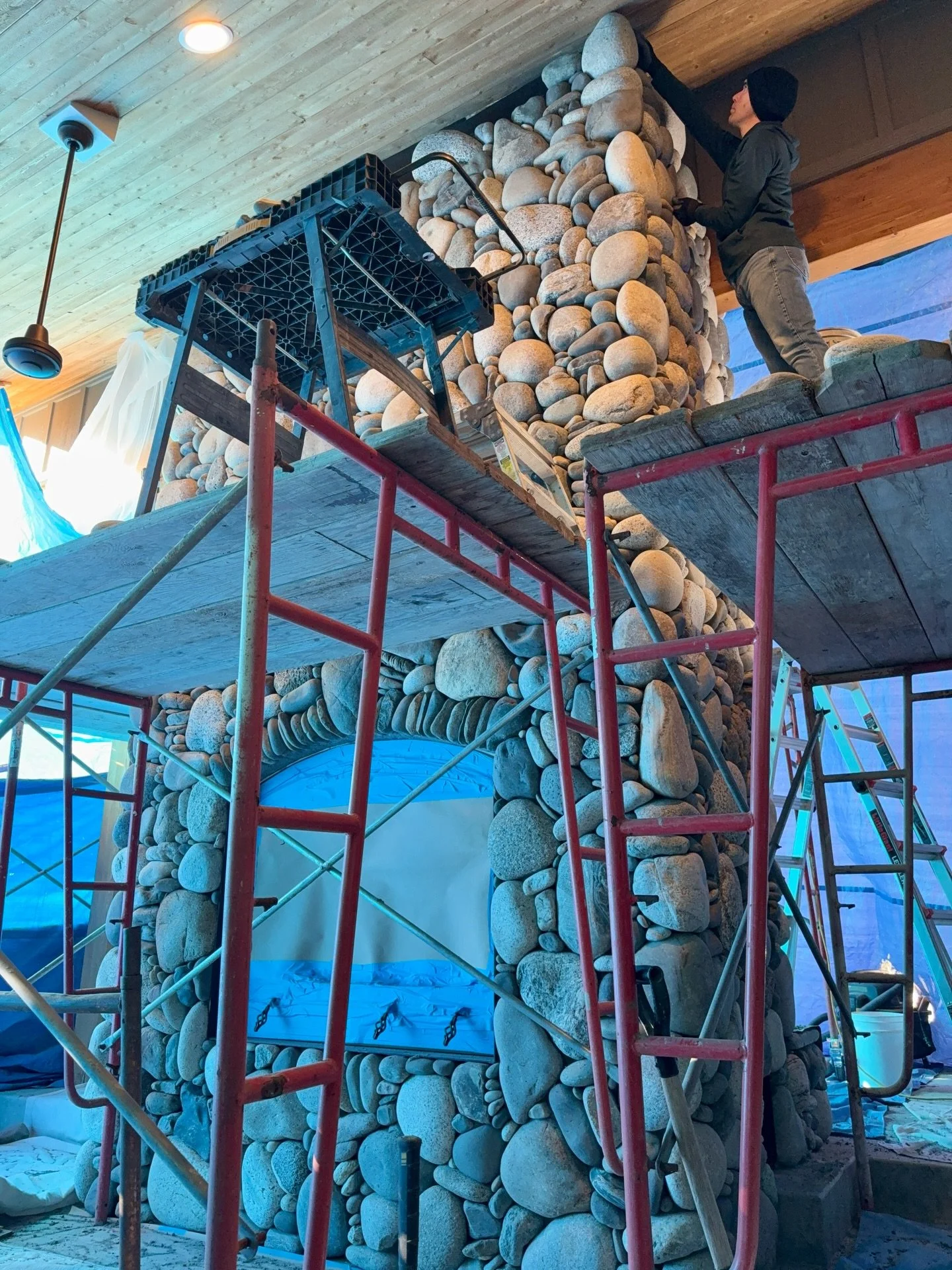 Getting the last few stones up #millerstoneworks #stone #stoneart #stonework #stonemasonry #stonemason #naturalstone #drystackstone #design #stonedesign #construction #contractor #masonrycontractor #masonry #stonefireplace #fireplace #fireplacedesign