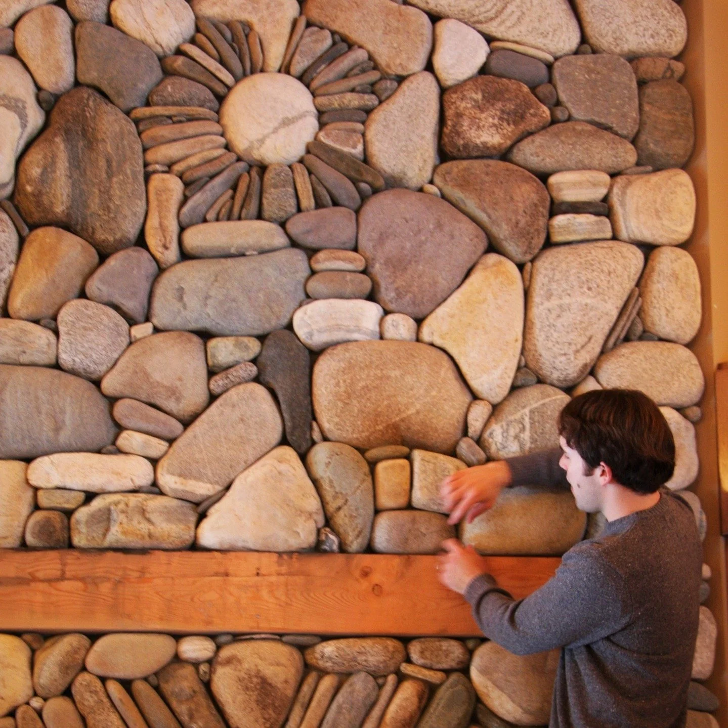 Found an old pic from one of our first fireplaces #millerstoneworks #fireplace #stonework #masonry #riverrock