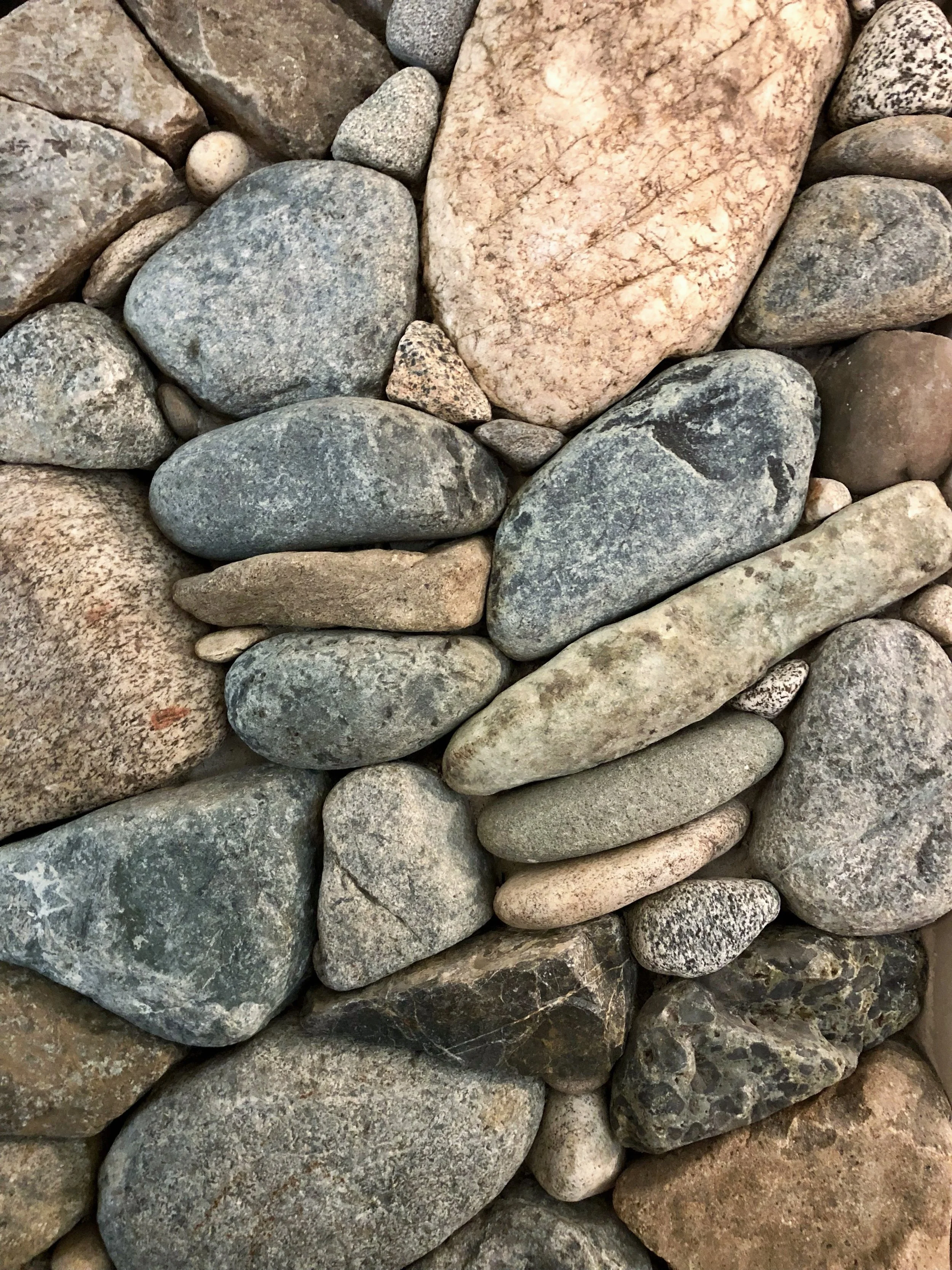 Sometimes the rocks look and feel old, although I have no idea how to tell the age of a stone #millerstoneworks #stonemasonry #stonemason #riverrock #stonedesign