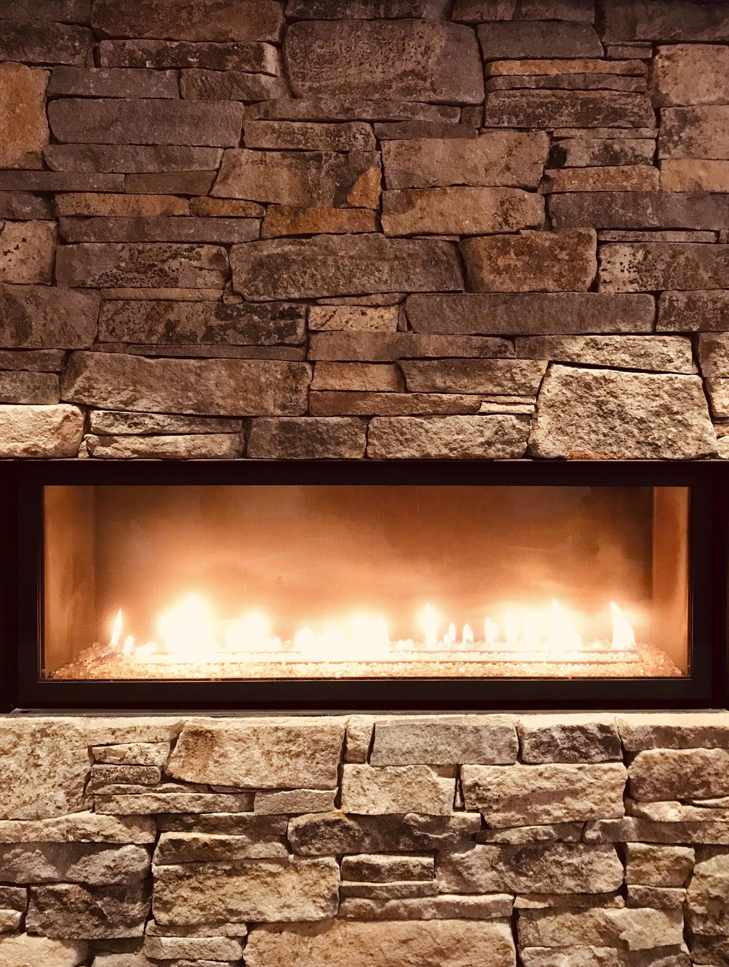 It's getting cold outside, but a fireplace is always there to warm you up #millerstoneworks #fireplace #fireplacedesign #stonedesign #stonemasonry