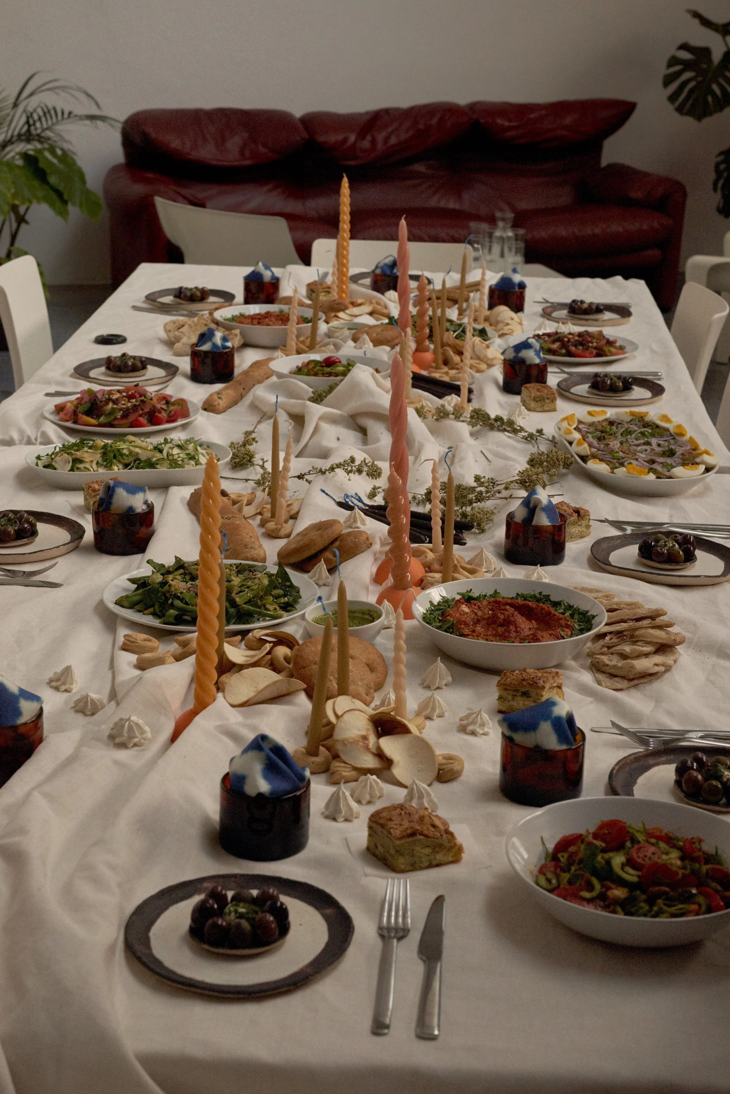 table setting with plates candles and food