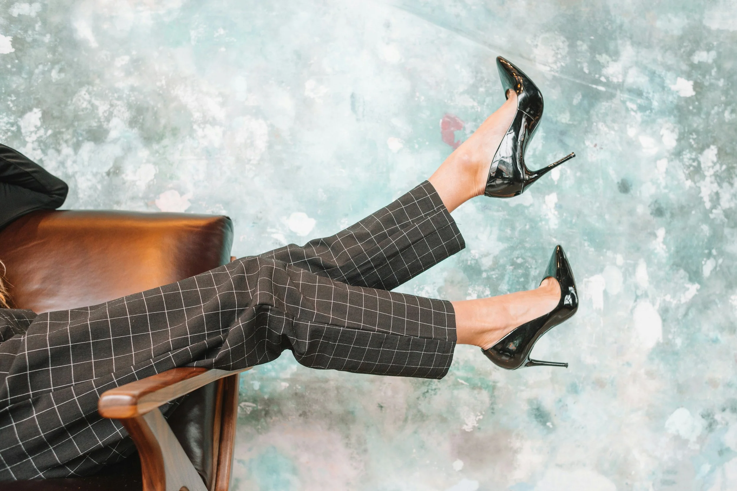 Pants featuring gray and white windowpane print