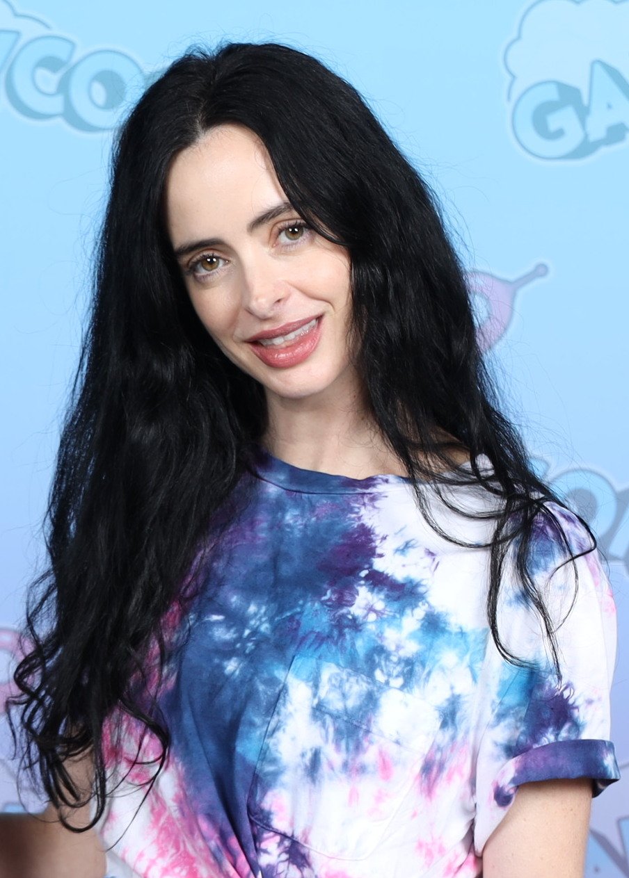 Krysten Ritter in minimal makeup and a tie-dye top