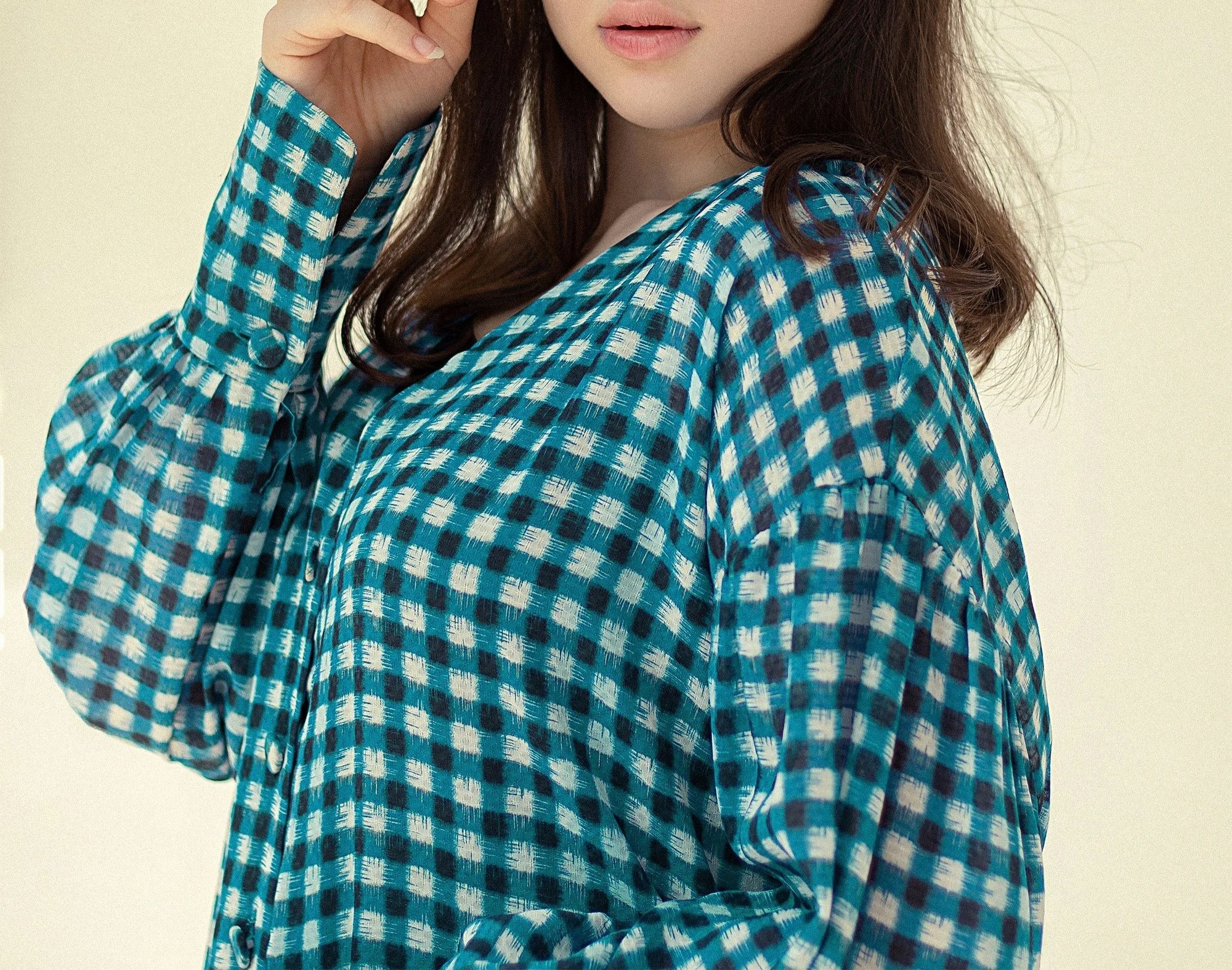 Shirt featuring blue and white gingham with high-contrast colors