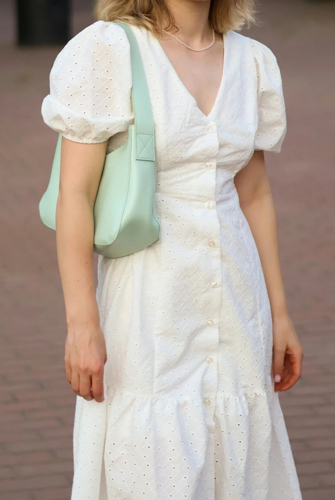 Highly Ingenue eyelet lace dress with Dramatic essence deep V neckline and Gamine pop of color rectangular bag.