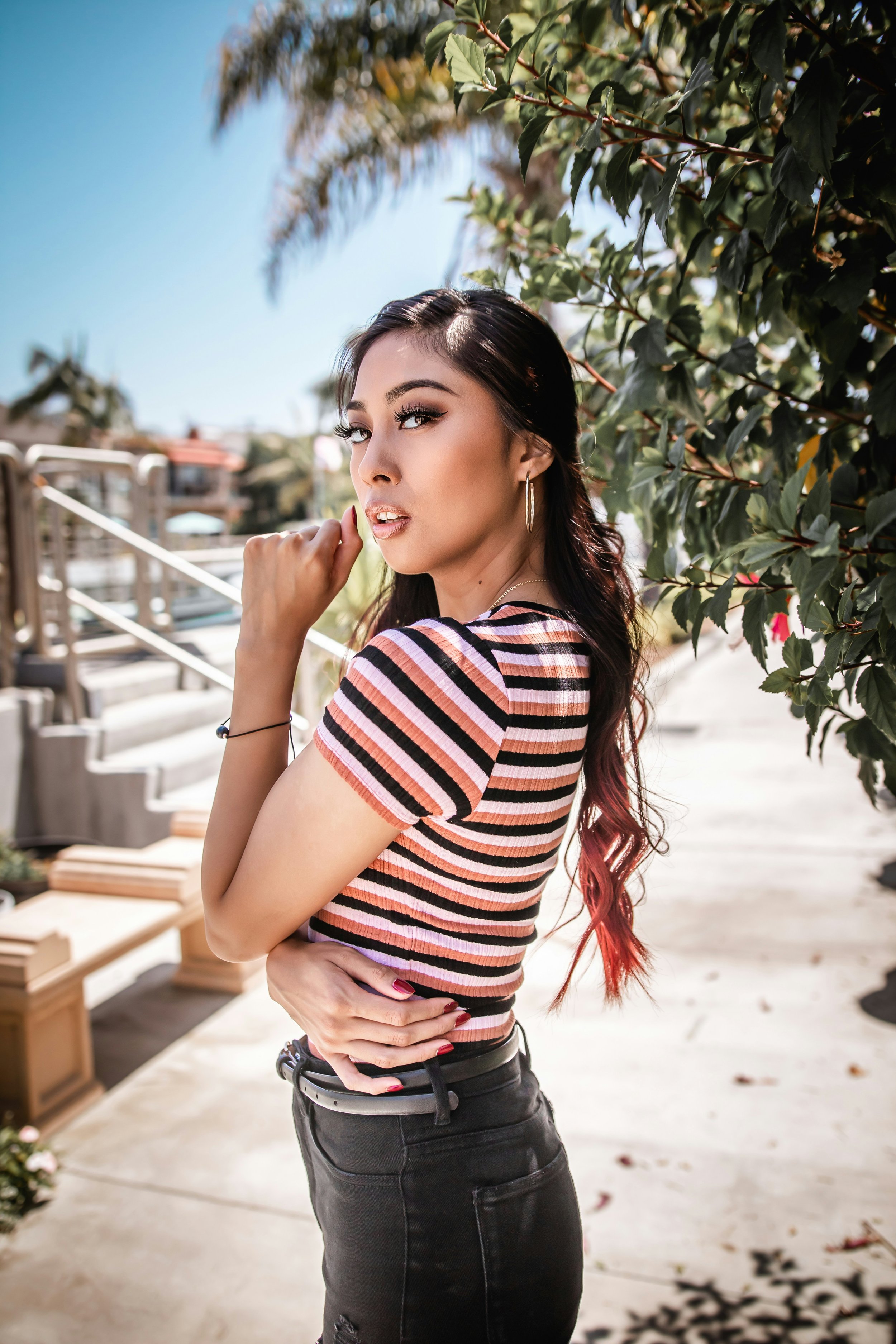 Gamine essence printed crop top featuring black, white, and orange stripes