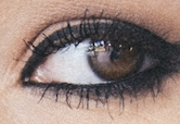 Eye with dark eyeliner applied all around the eye above and below