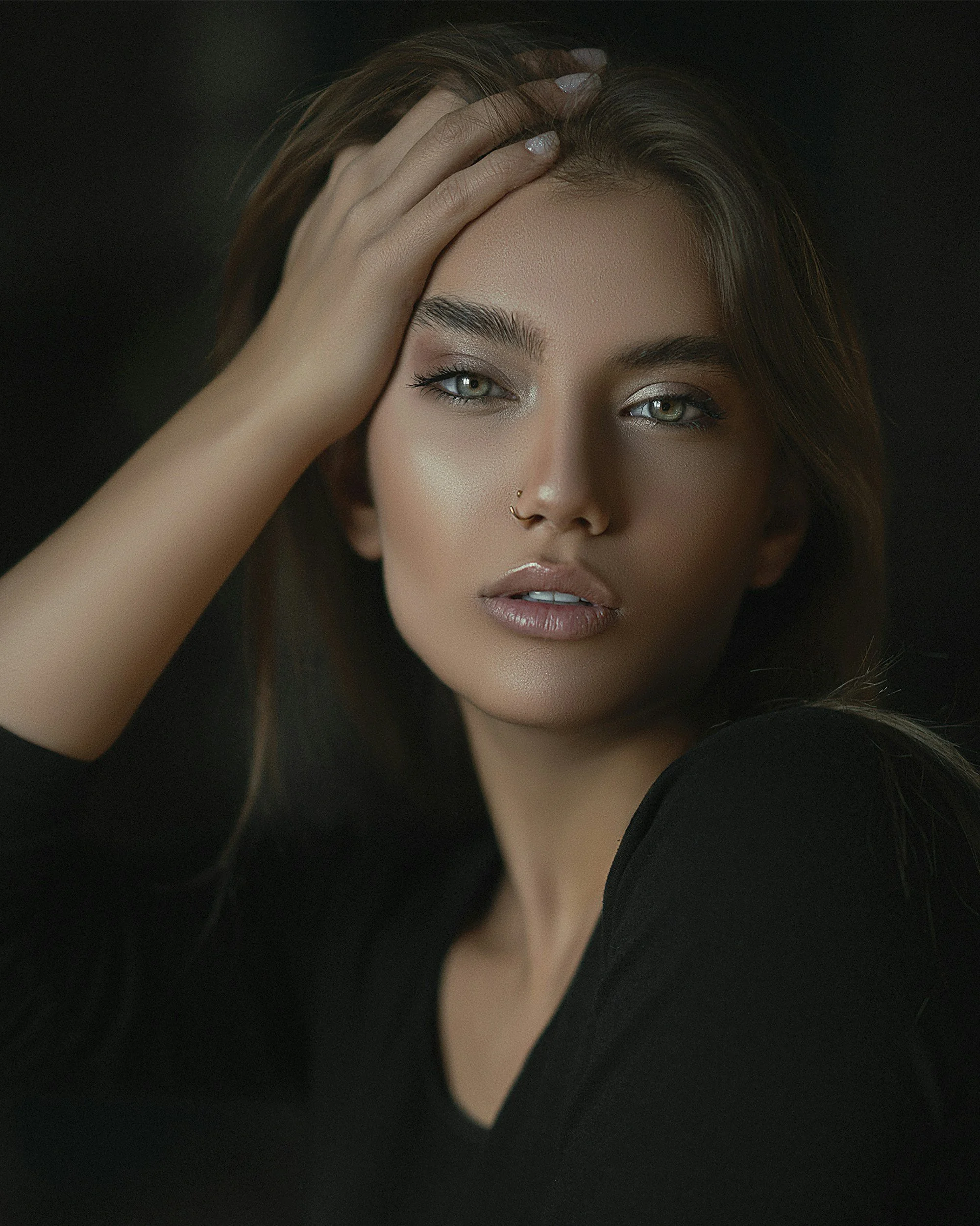 Woman with the ethereal face essence, tan skin, and green eyes in a dreamy Ethereal full makeup look