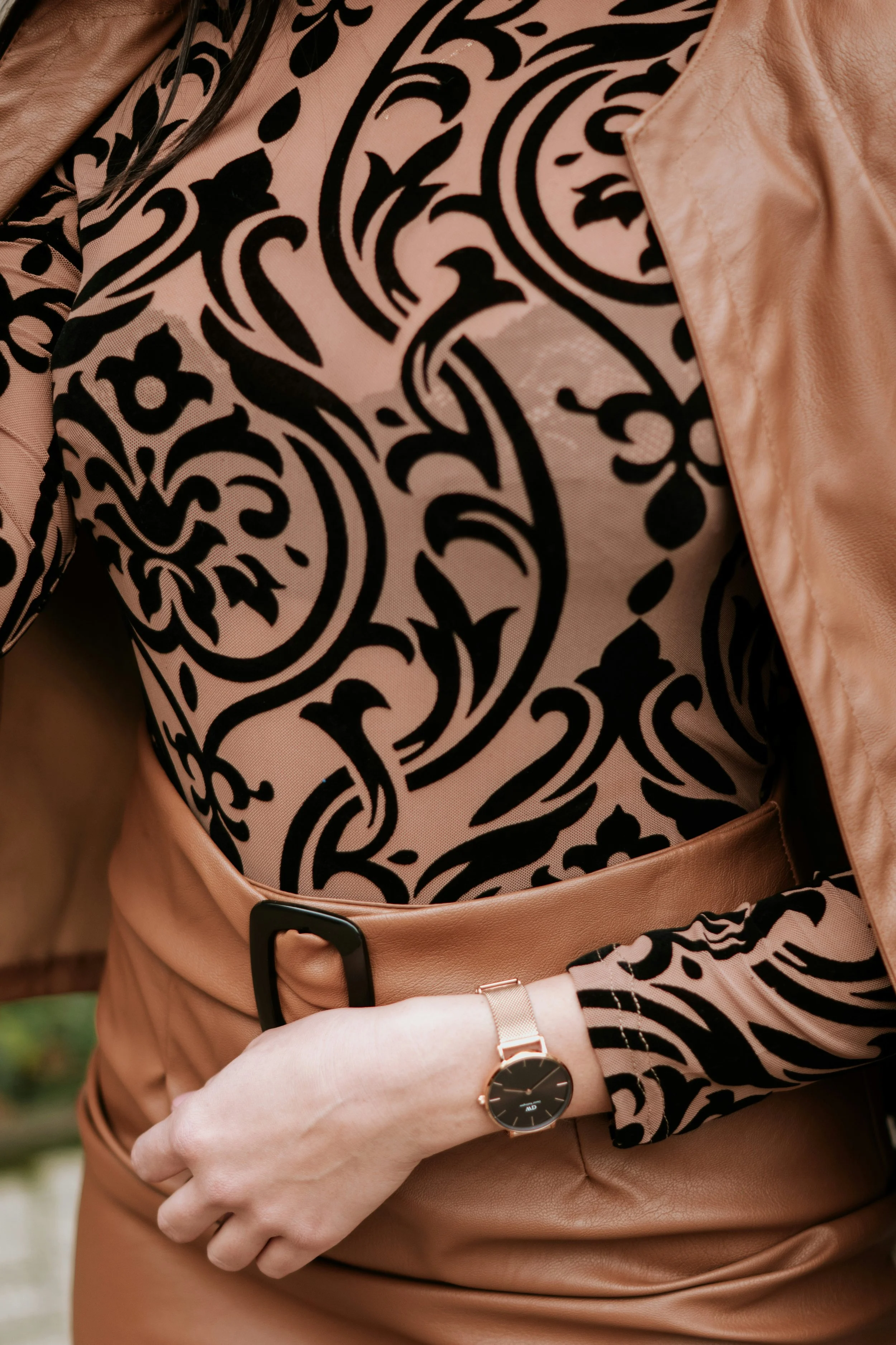 Beige and black shirt with Romantic essence scrollwork motif