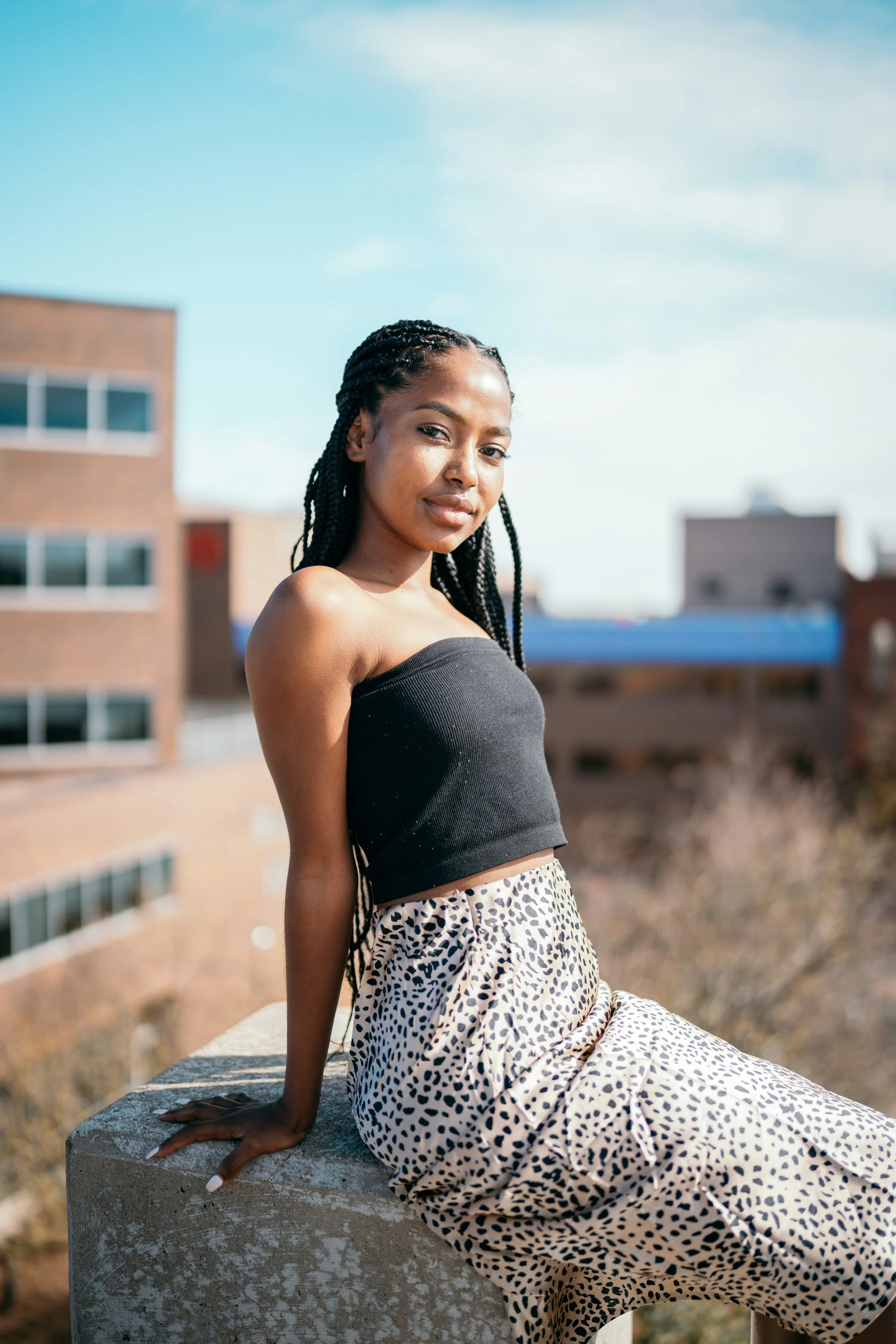 Woman wearing cropped tube top and Romantic essence cheetah skirt