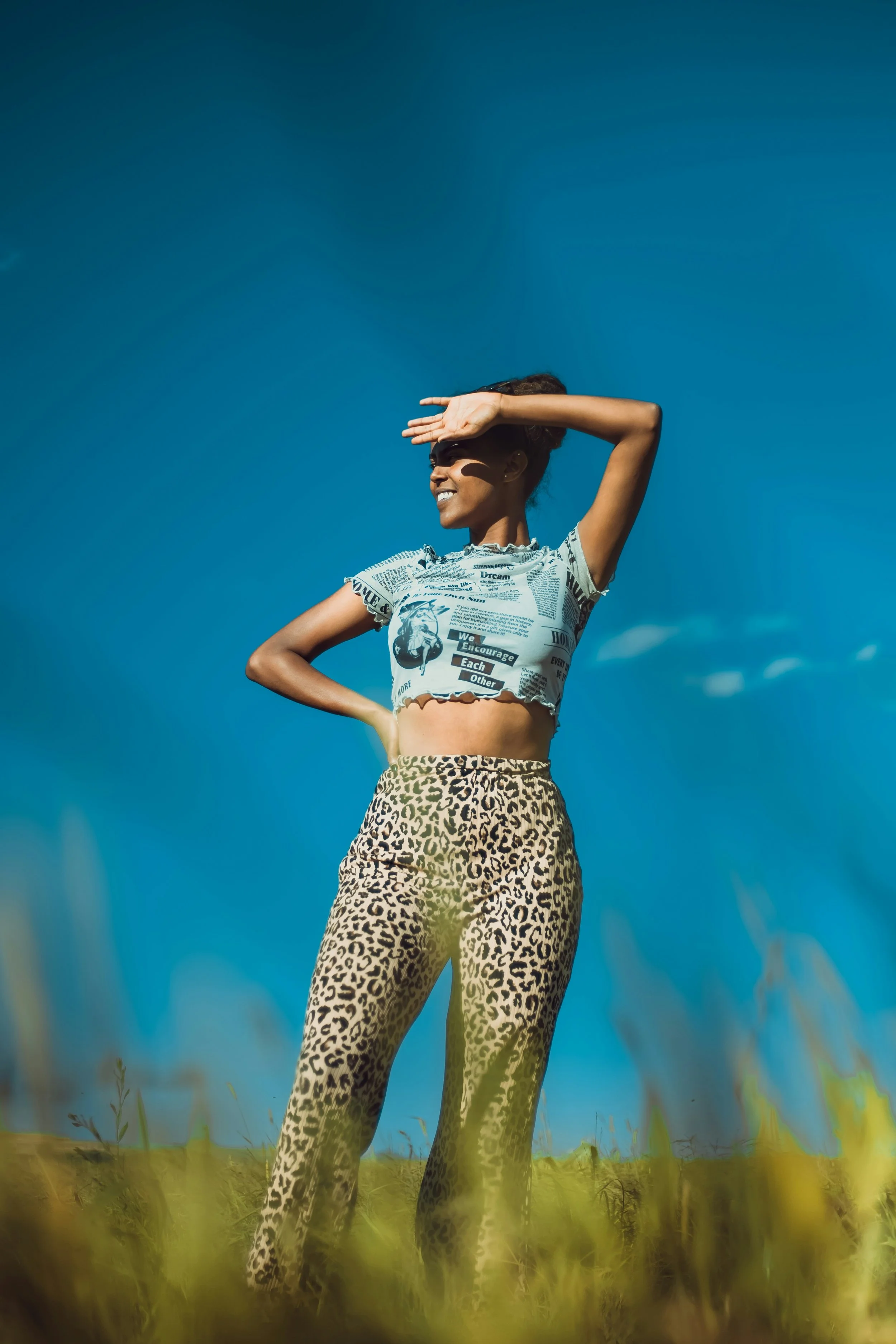 Woman wearing a Romantic Gamine crop top and leopard pants outfit