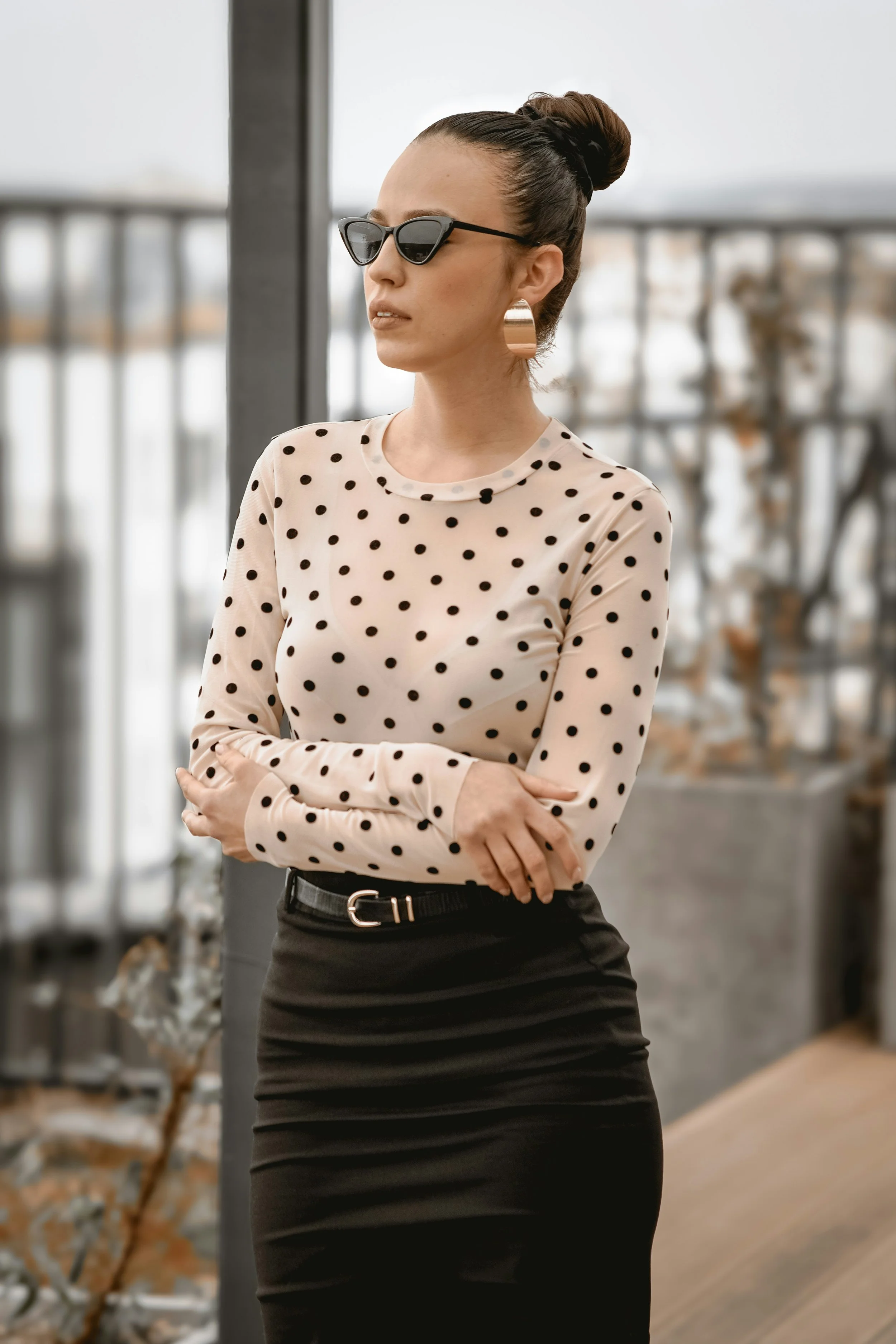 Woman wearing a black and white polka-dot top