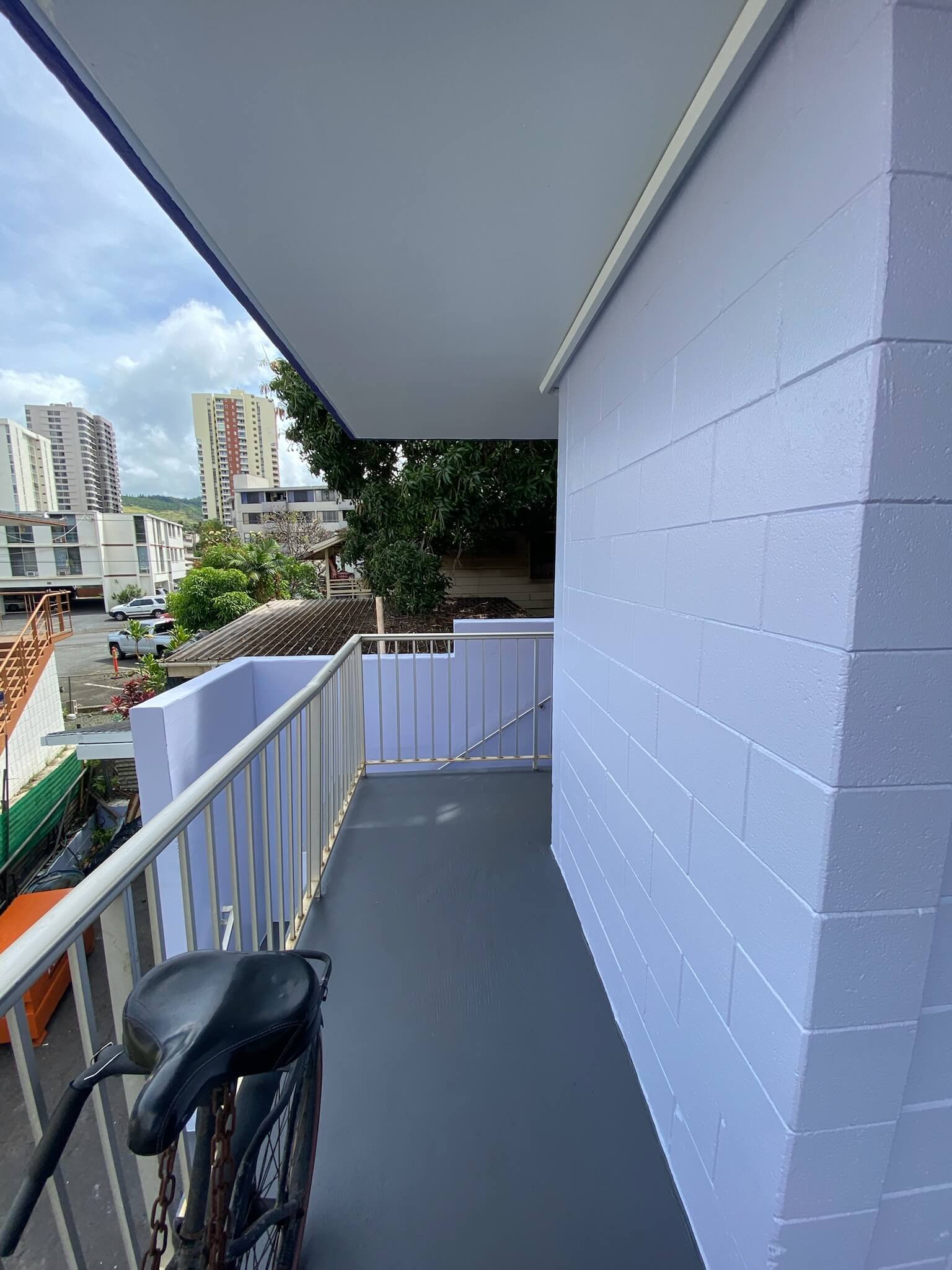 Mid Rise Condo Building Exterior Renovation completed by Hale Partners Hawaii walkway and stairs shown.jpeg