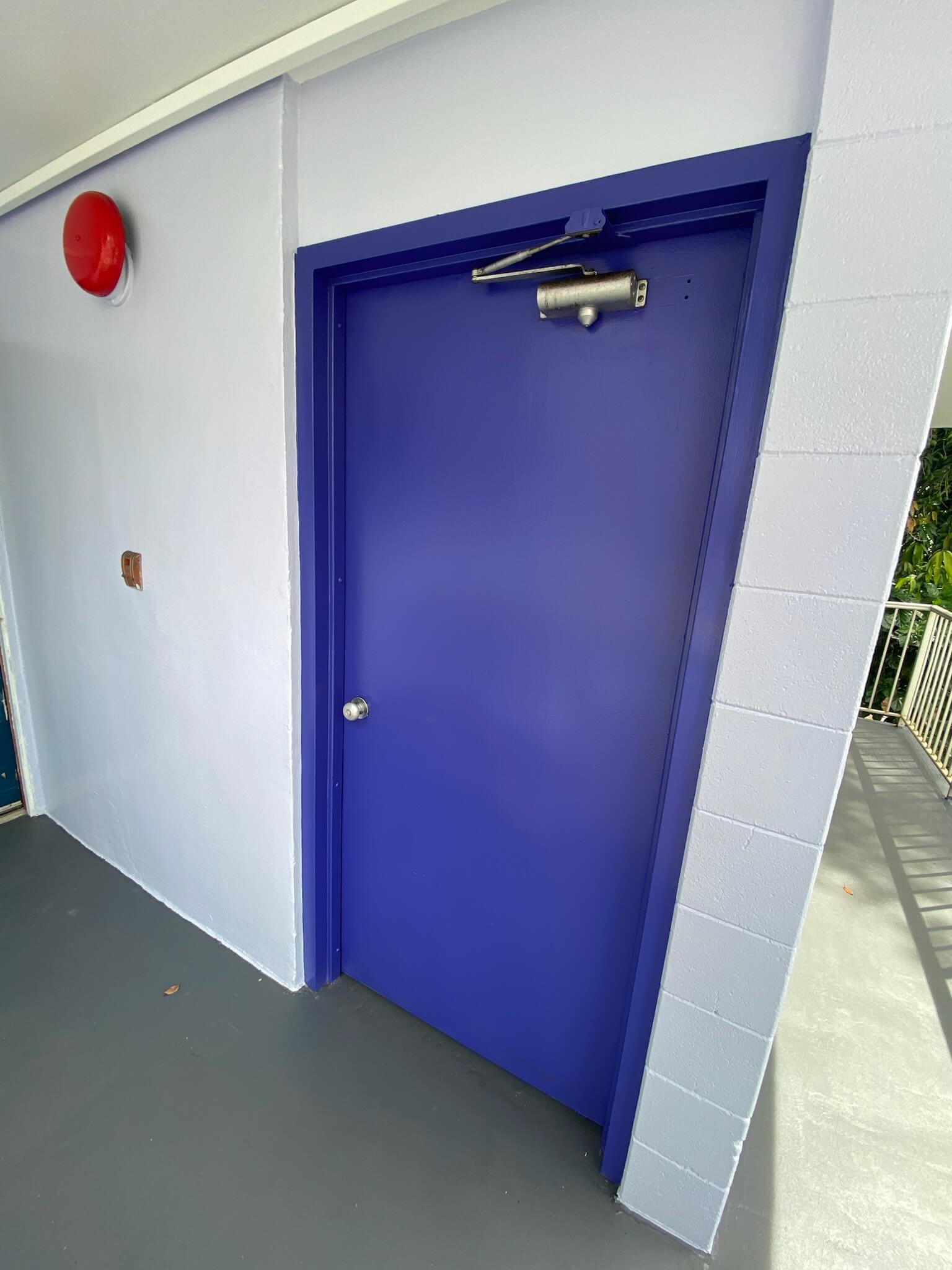 Midrise Condo Exterior renovation by Hale Partners Hawaii after photo - painted  door and hallway.jpeg