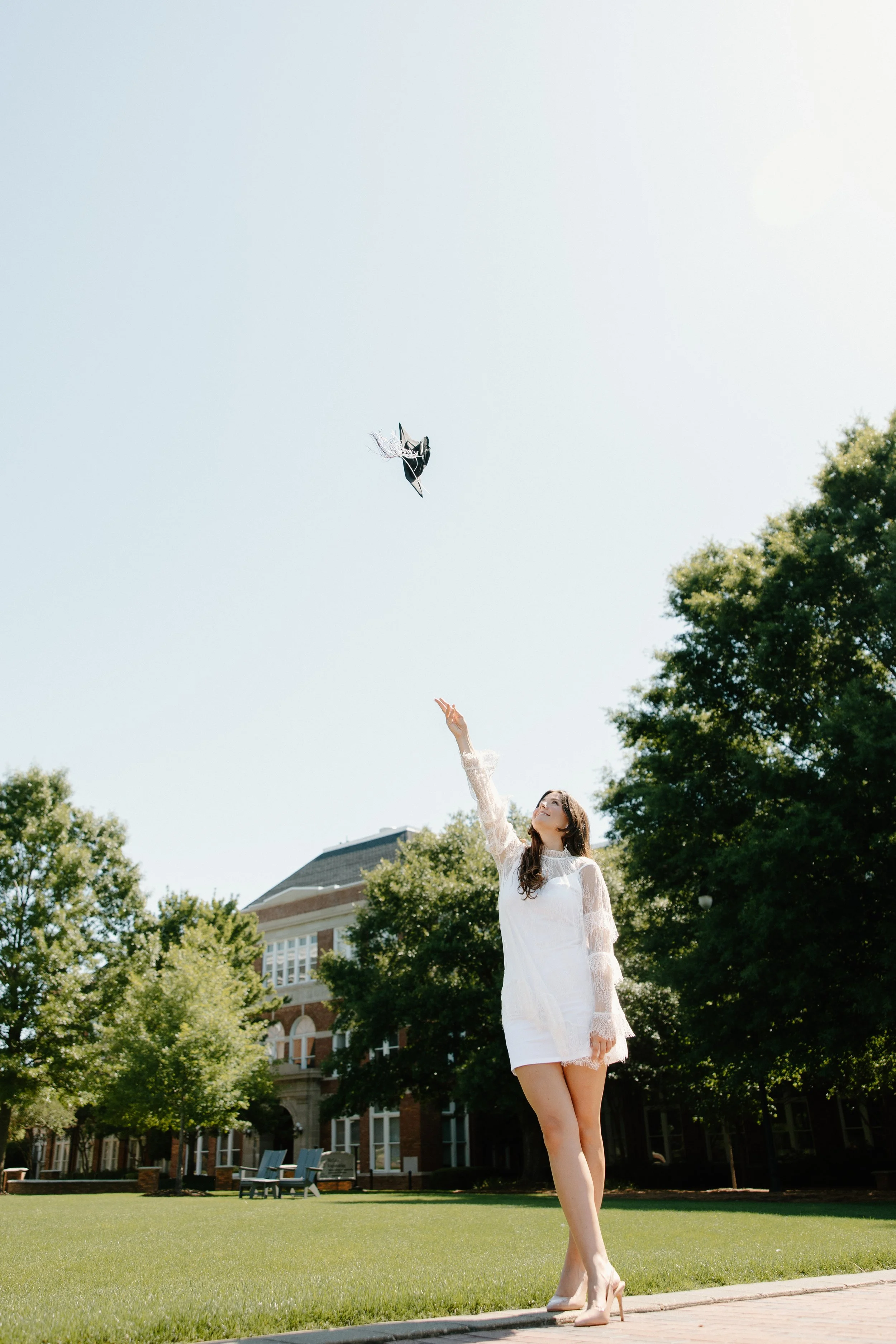 Mississippi State Starkville Senior Tossing Cap on Drill Field