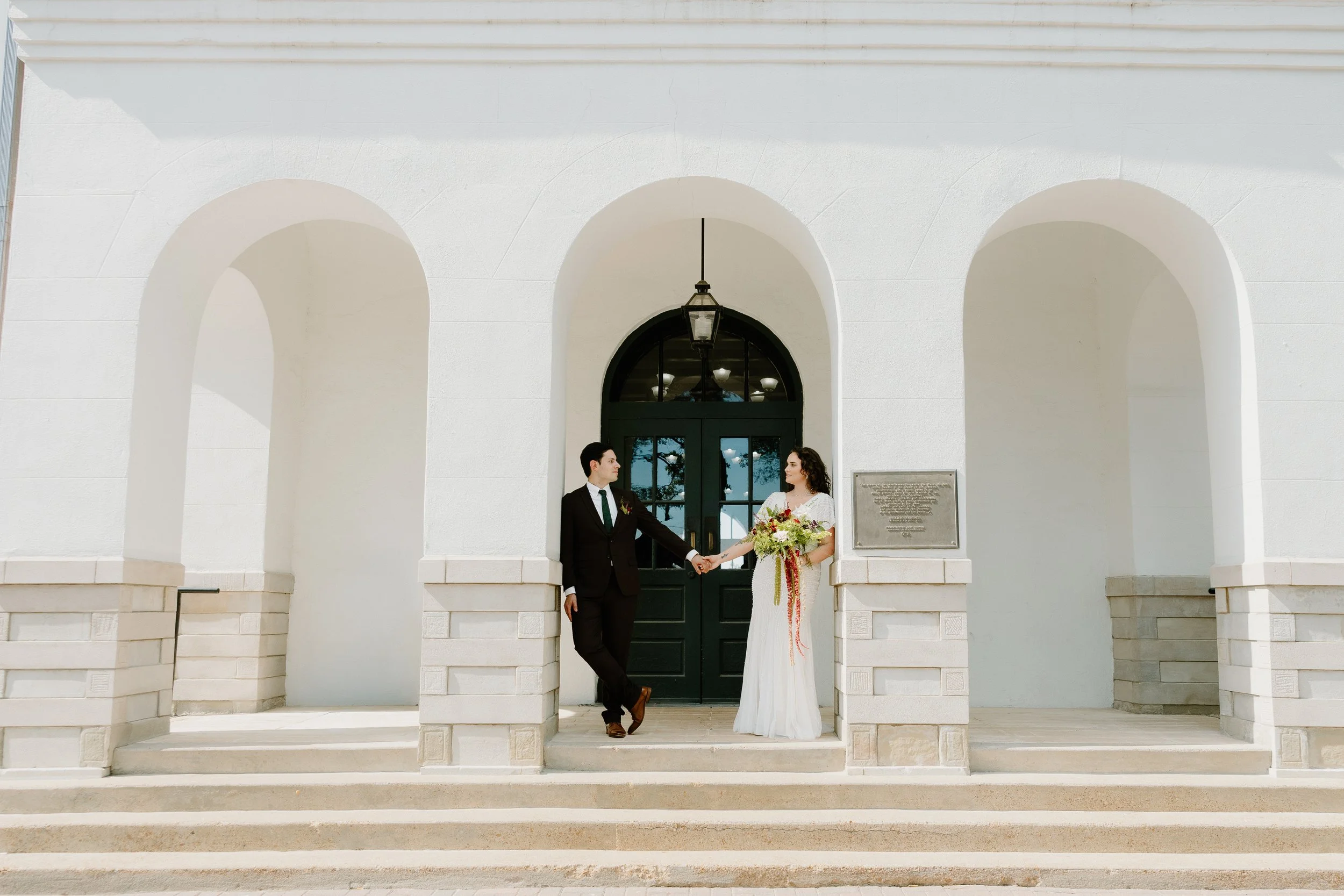 Husband and wife portraits outside courthouse downtown Oxford