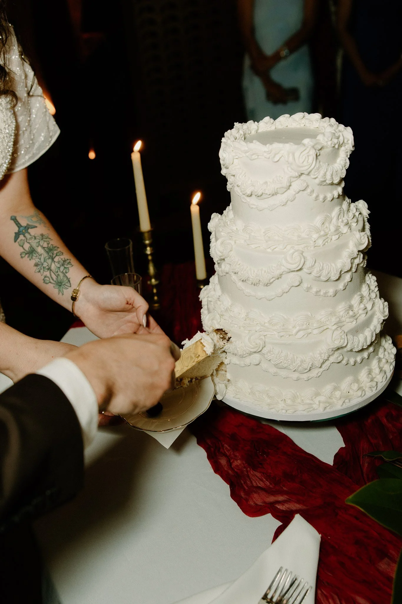 Bride and groom cutting wedding cake at Oxford wedding venue.