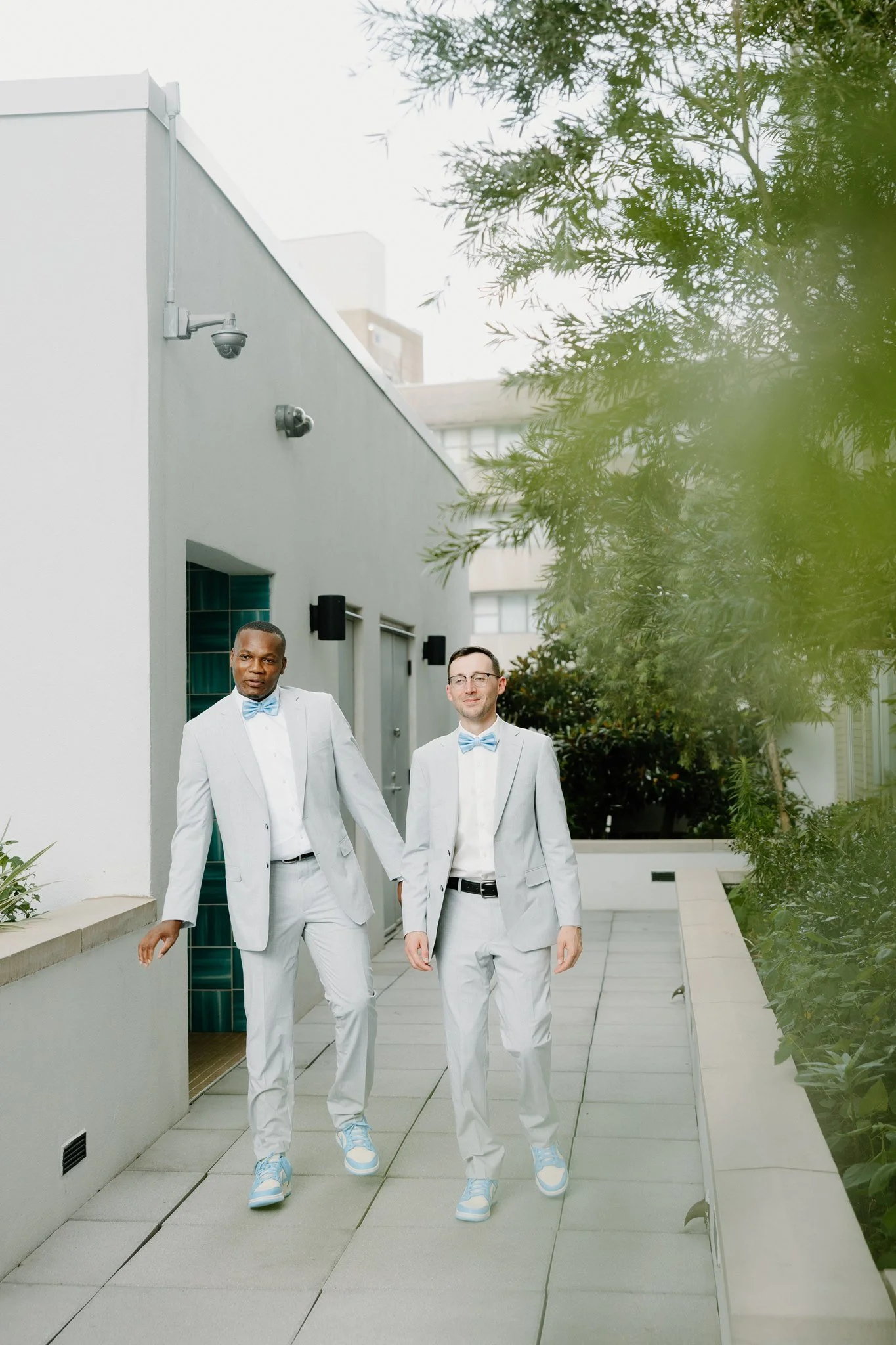 Groom portraits at pool rooftop in New Orleans.