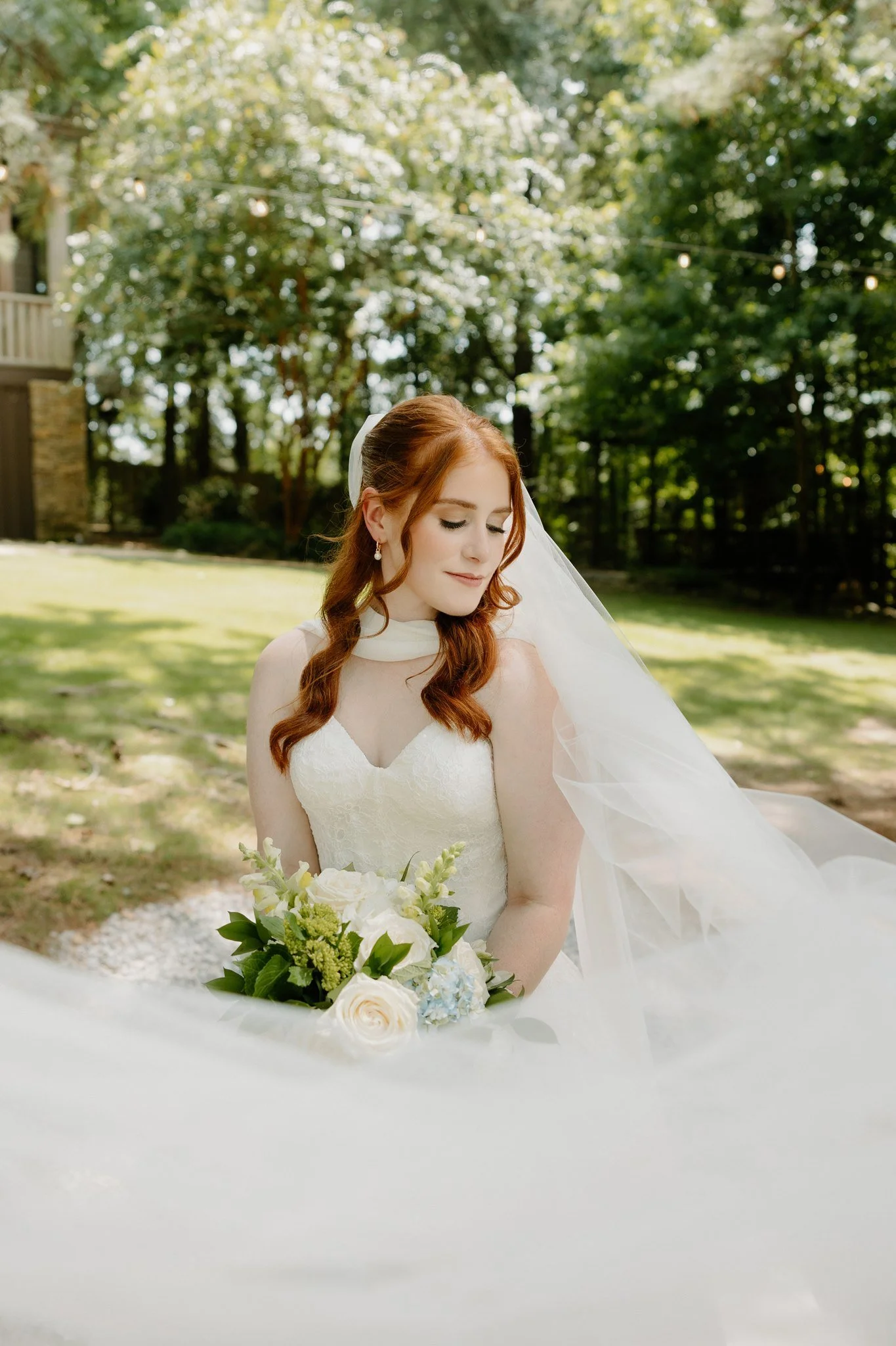 Bridal portraits at Kingfisher Lodge Wedding Venue in Tupelo, Mississippi, shot outdoors on Kingfisher grounds.