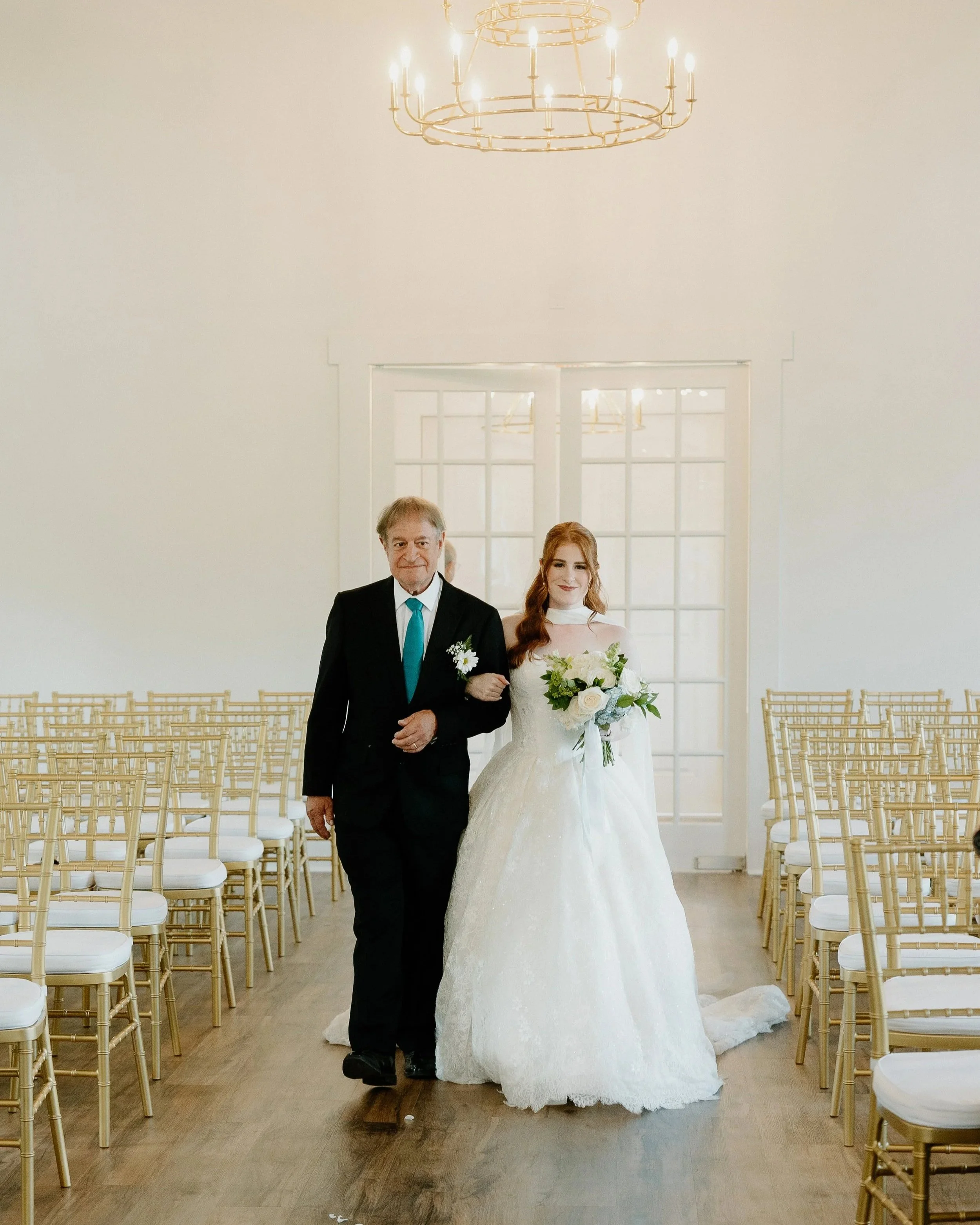 Dad and bride walking down the aisle in Kingfisher Lodge's indoor Chapel.